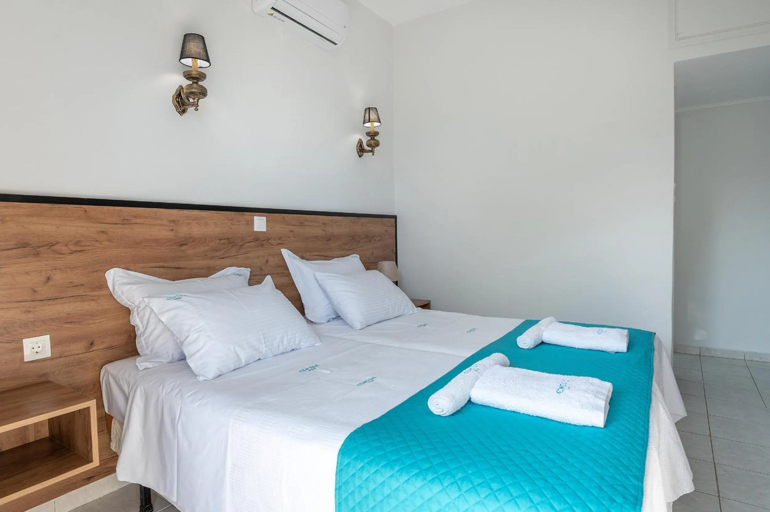 Bed in Genesis Hotel