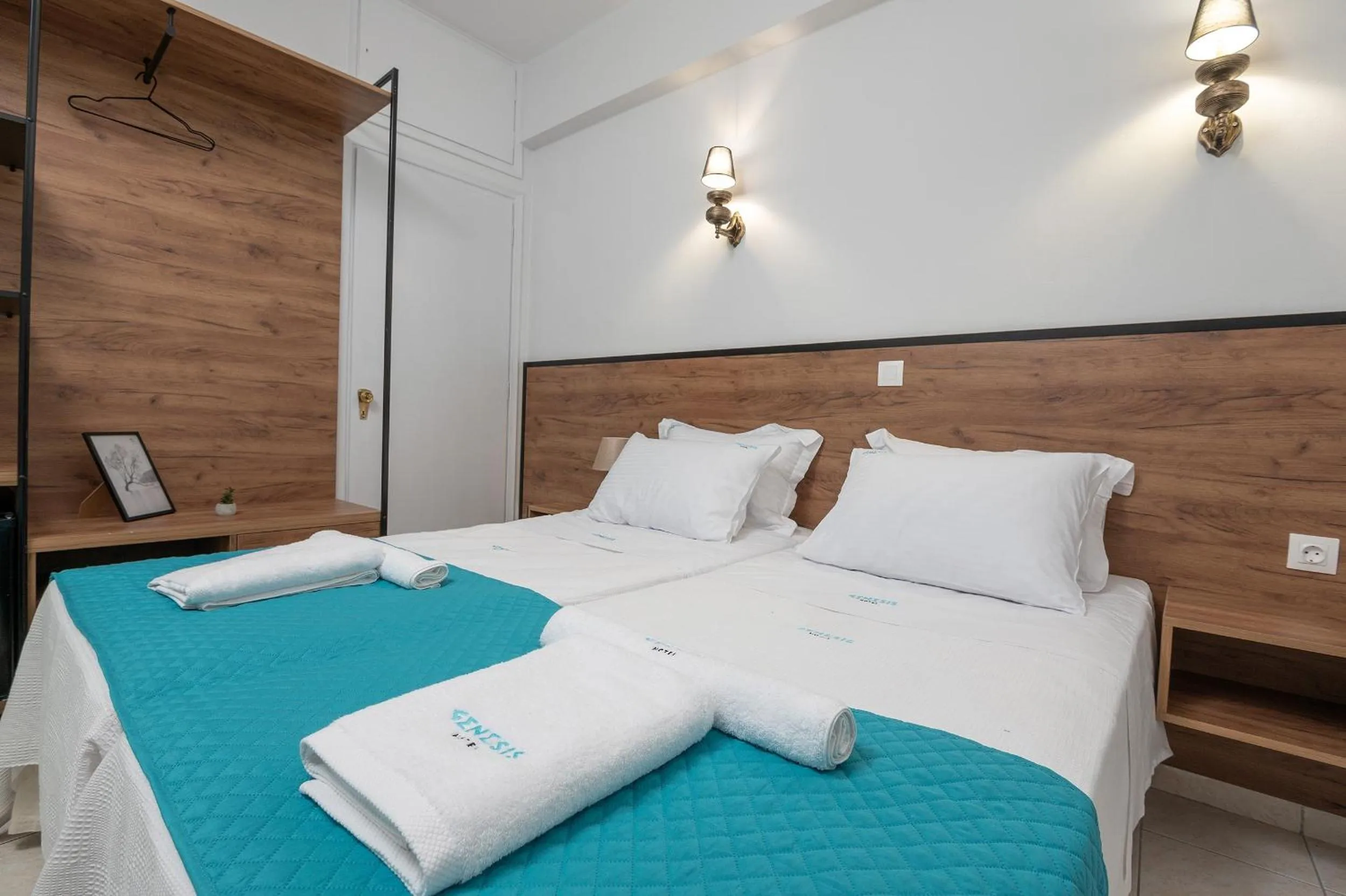 Bed in Genesis Hotel