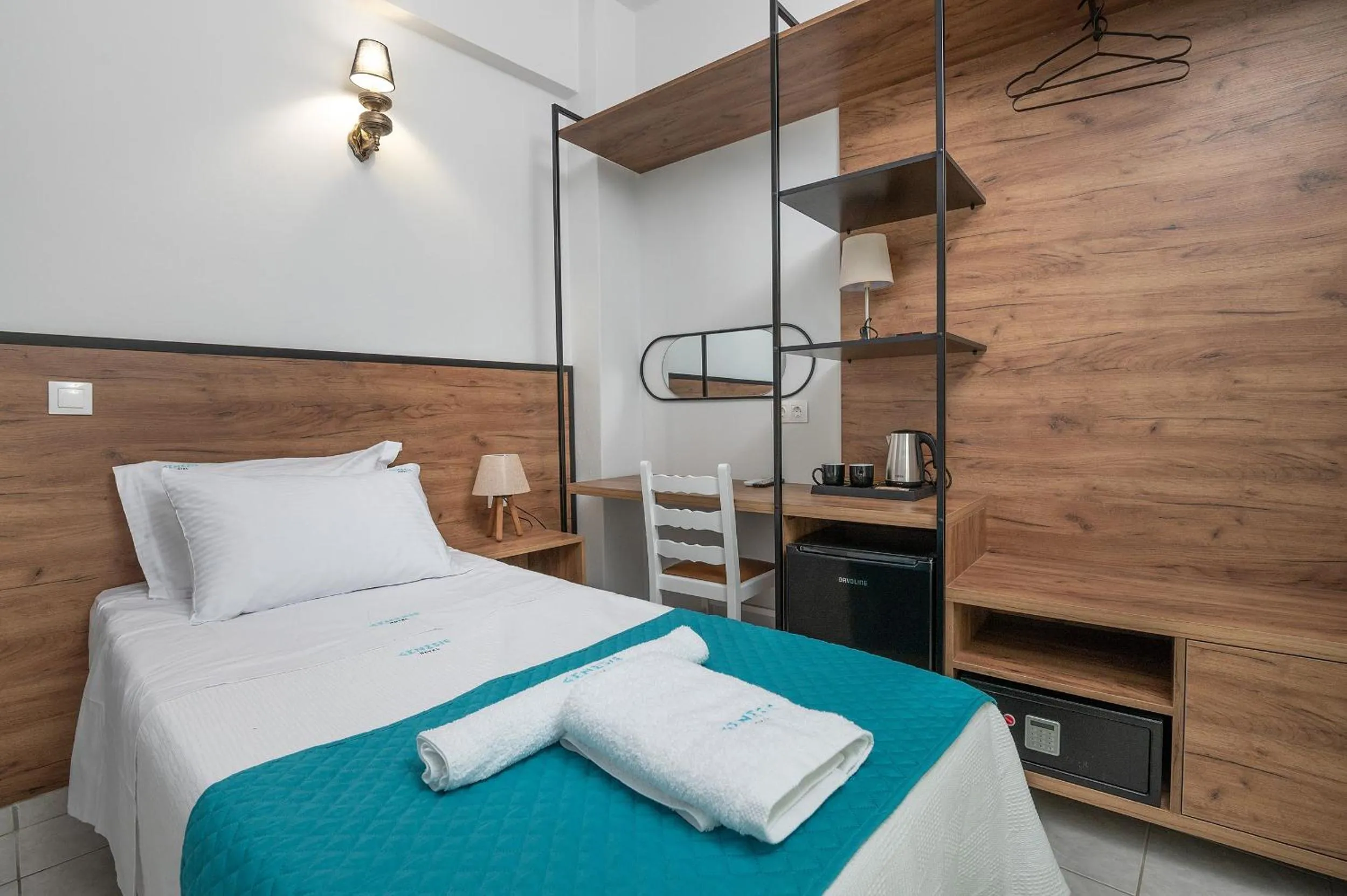 Bed in Genesis Hotel