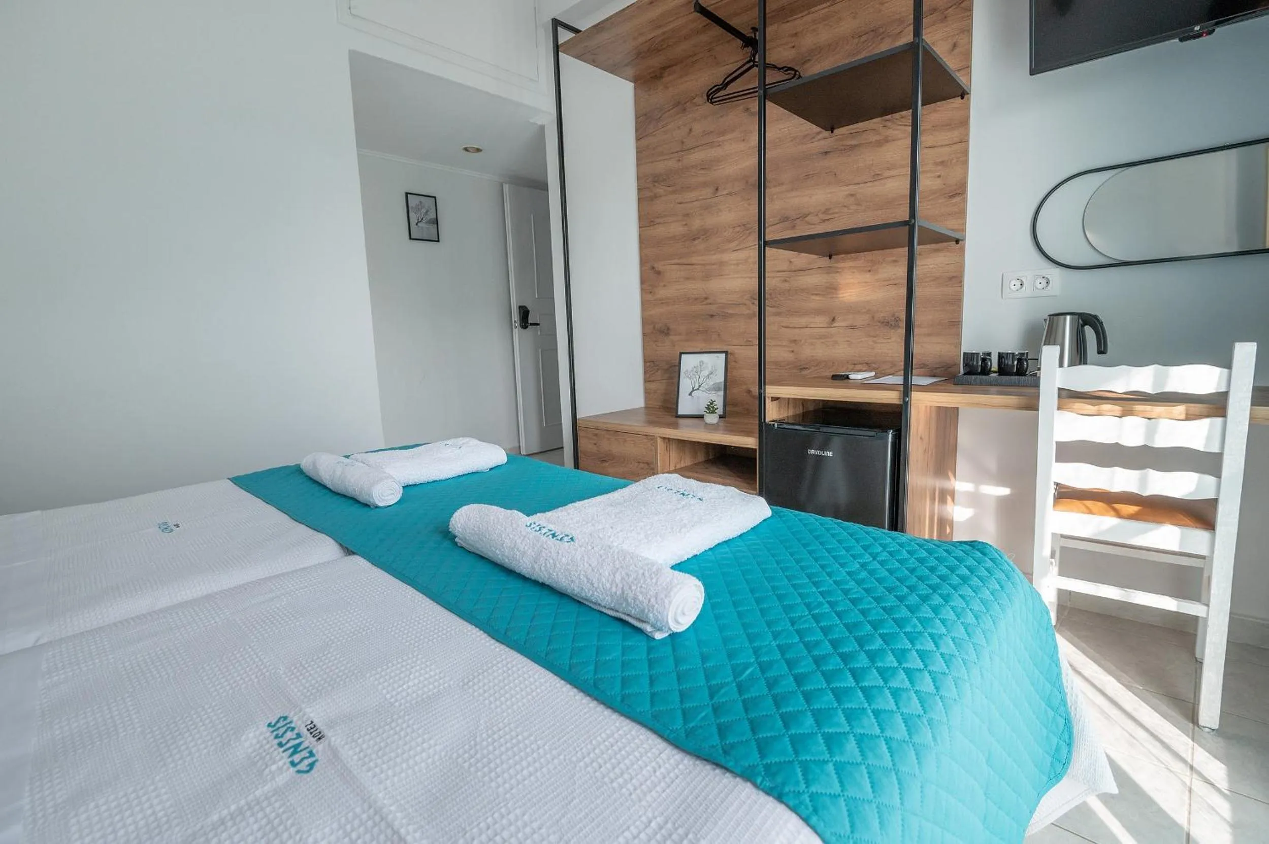 Bed in Genesis Hotel