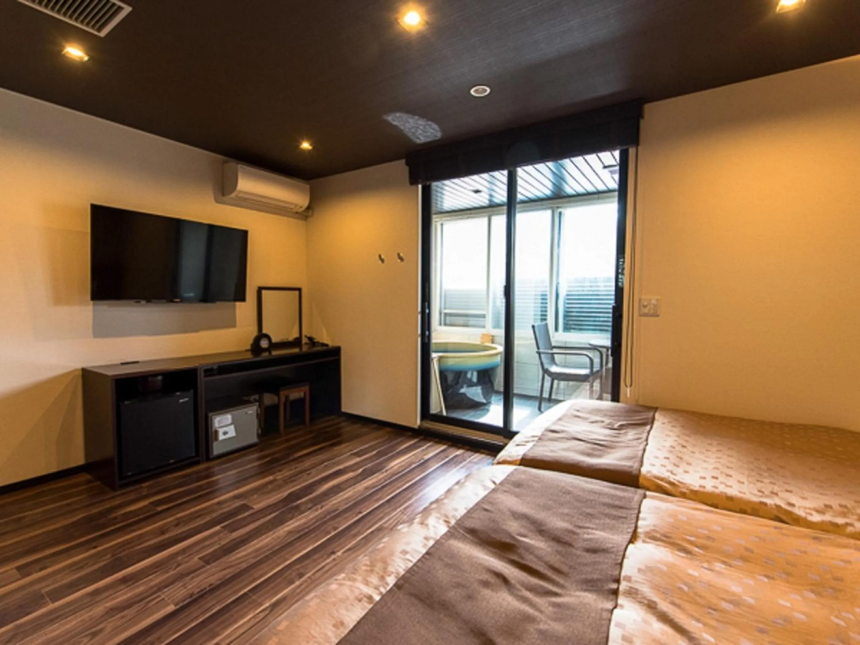 Bed in LiVEMAX RESORT Kaga Yamashiro