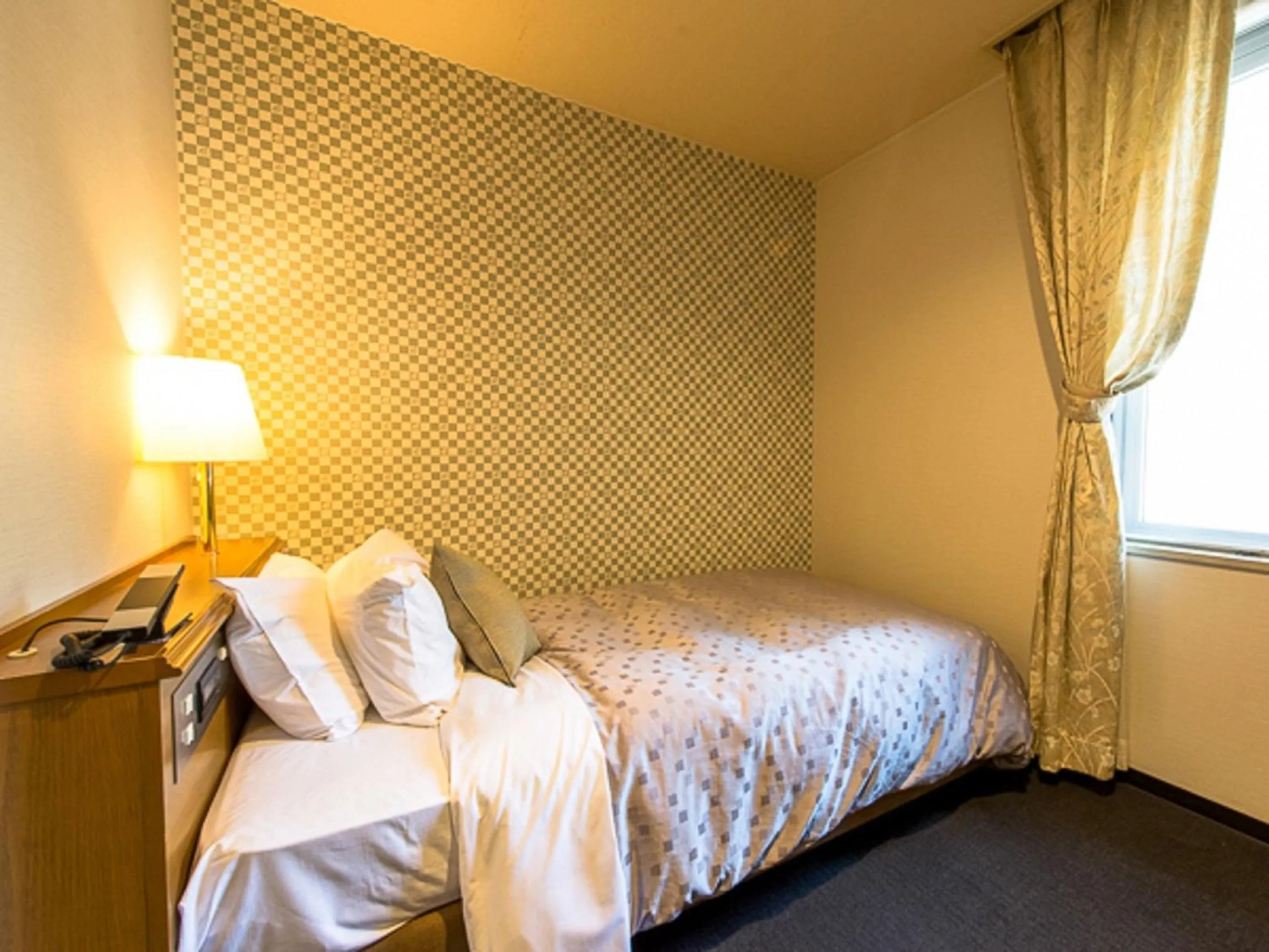 Bed in LiVEMAX RESORT Kaga Yamashiro