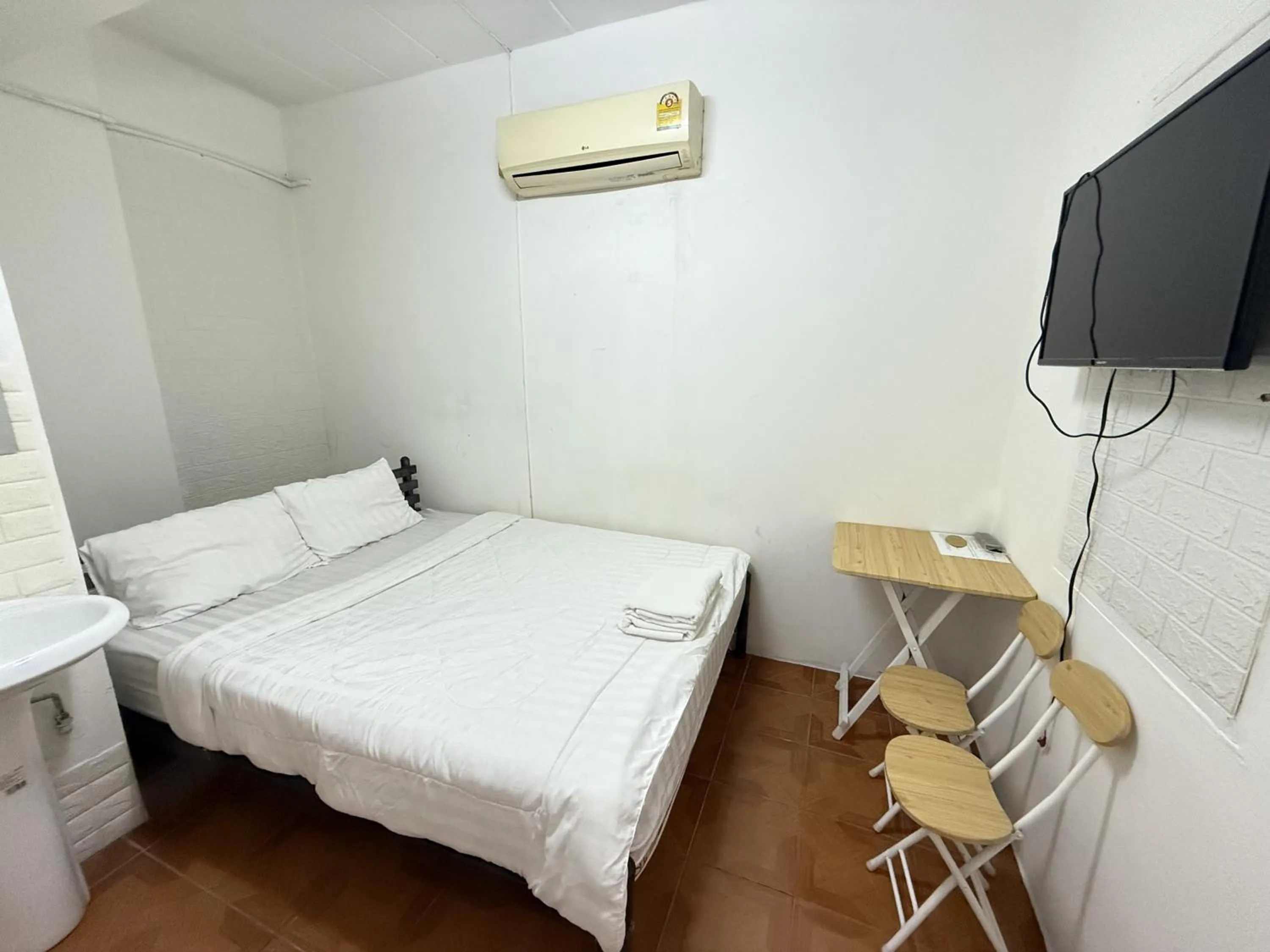 Bed in Happyland Guesthouse