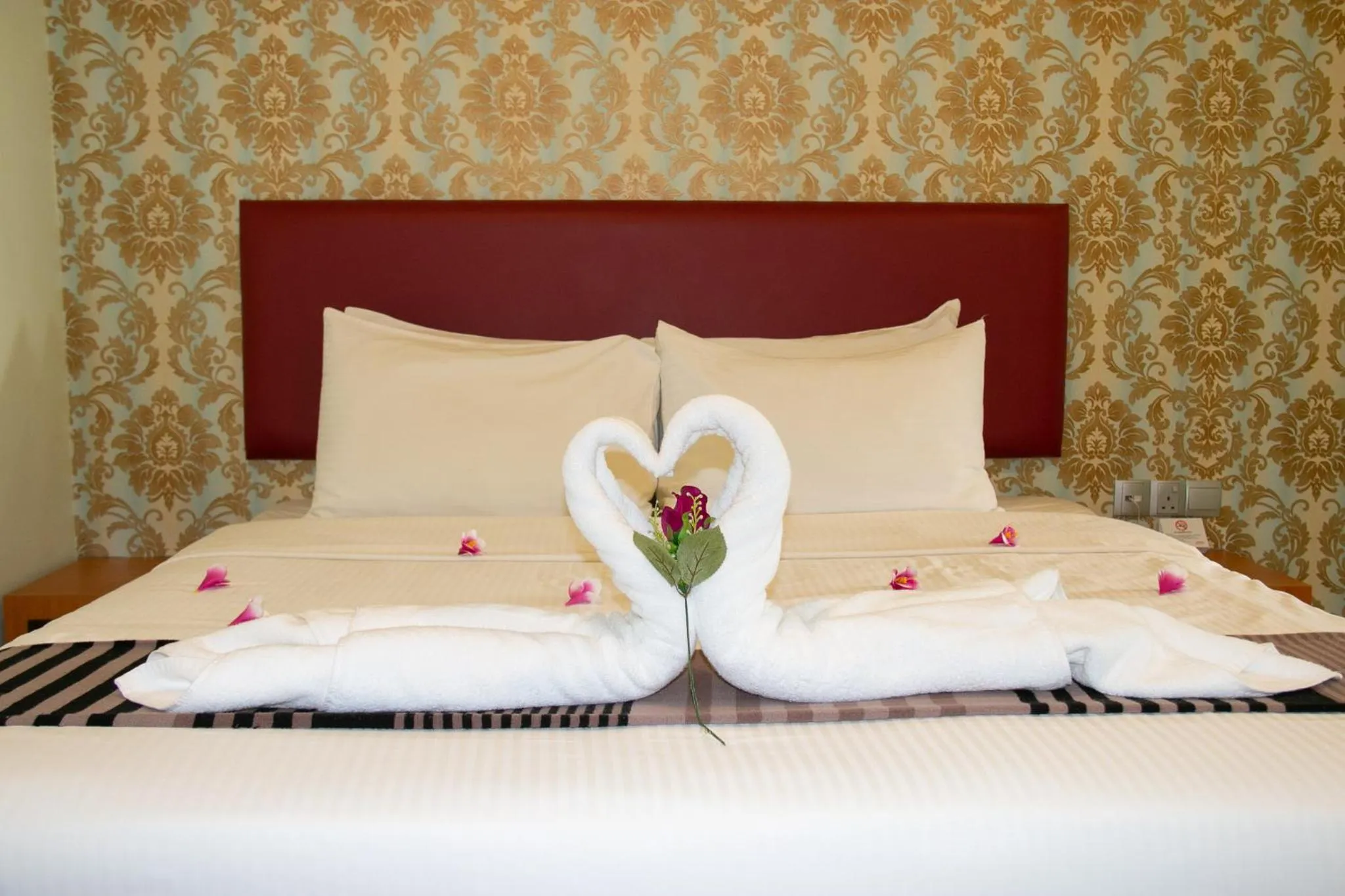 Bed in Prince 33 Hotel