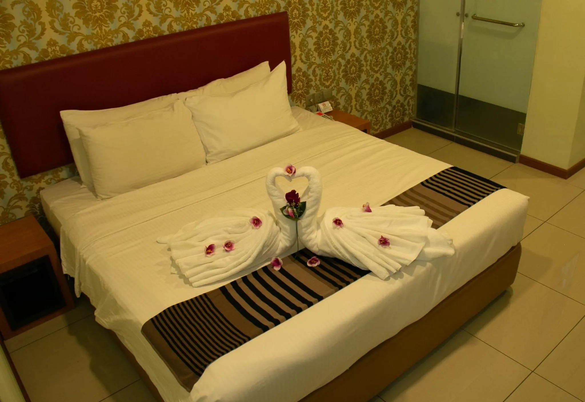 Bed in Prince 33 Hotel