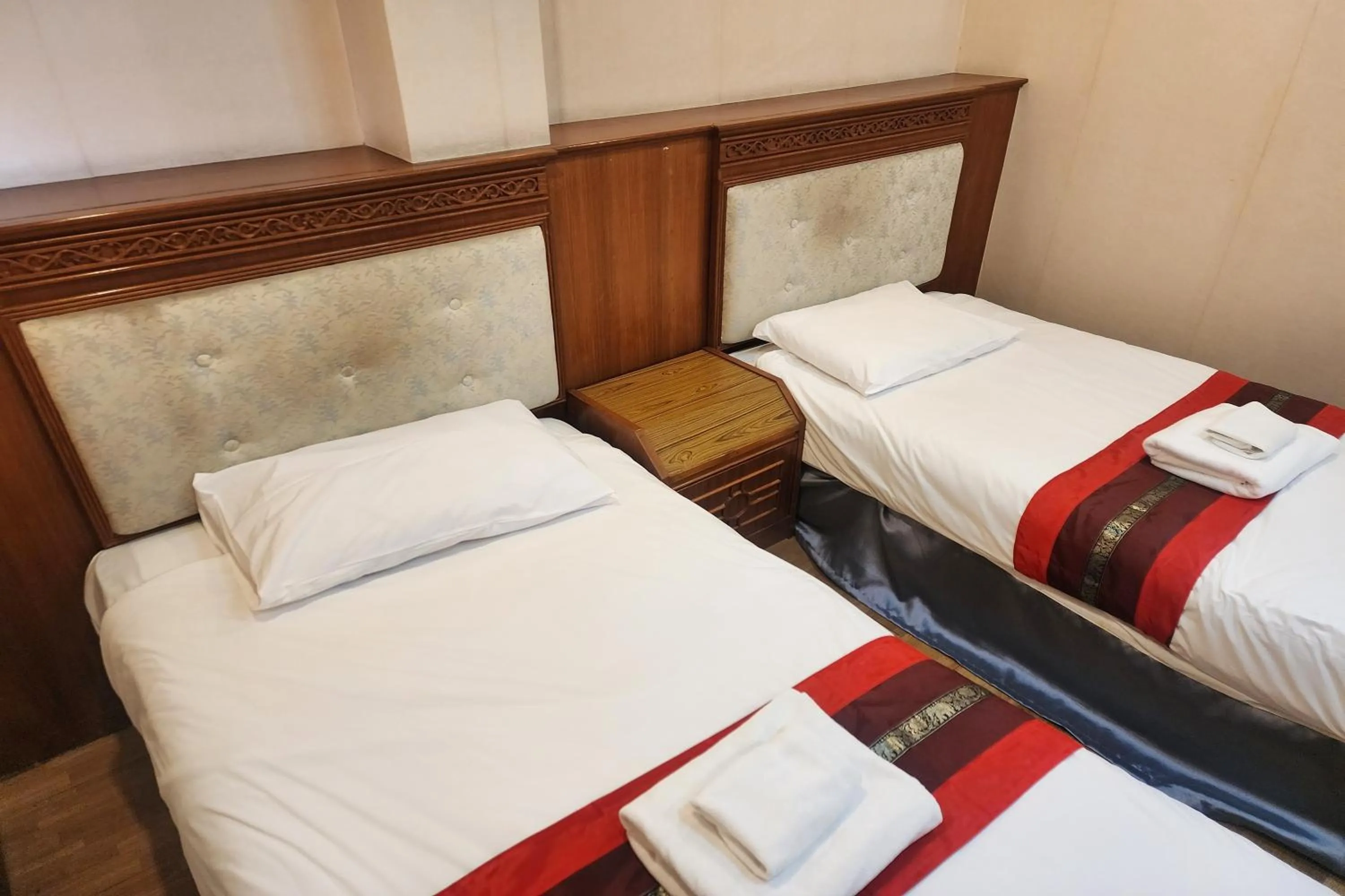 Bed in Suan Sunandha Palace Hotel