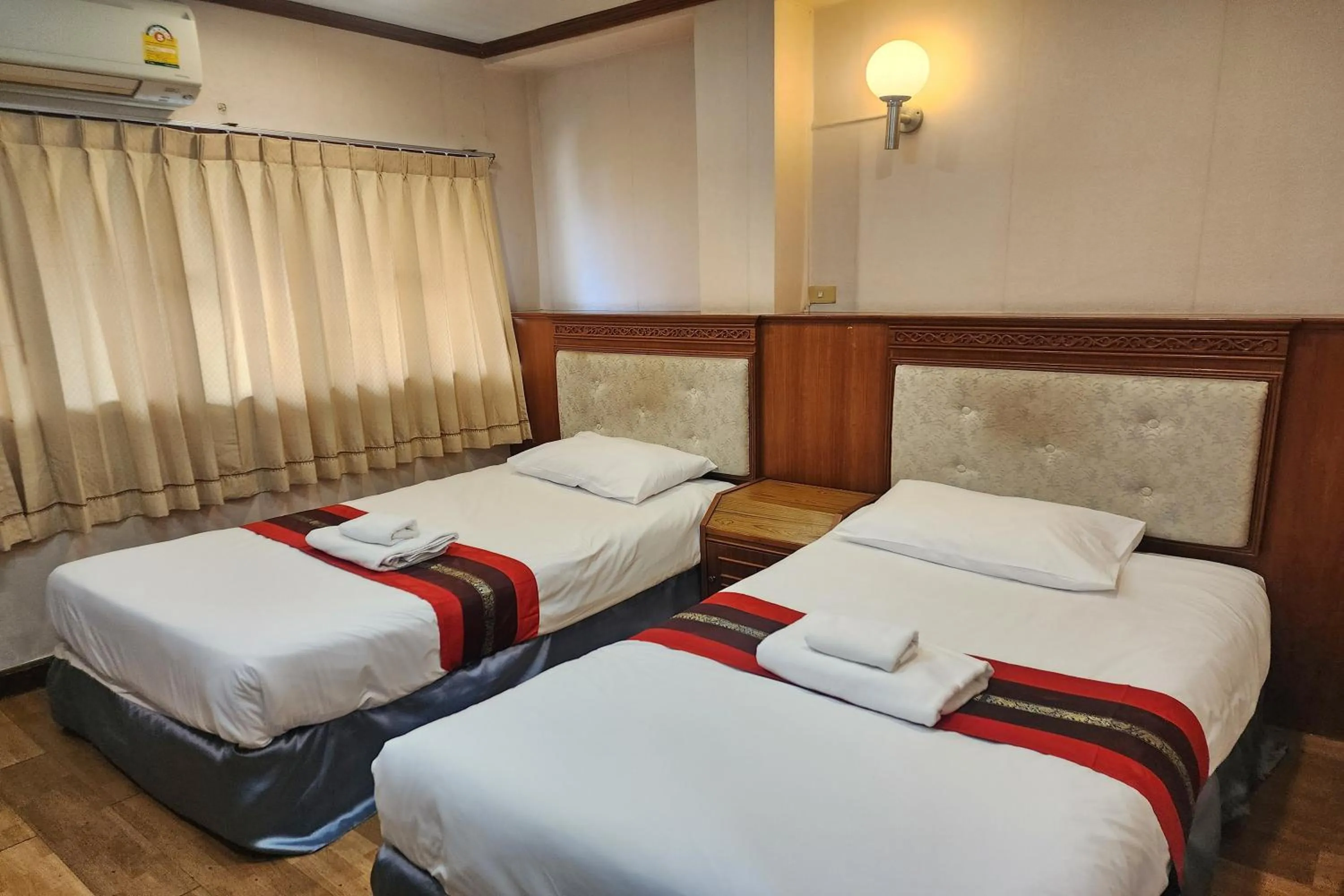 Bed in Suan Sunandha Palace Hotel