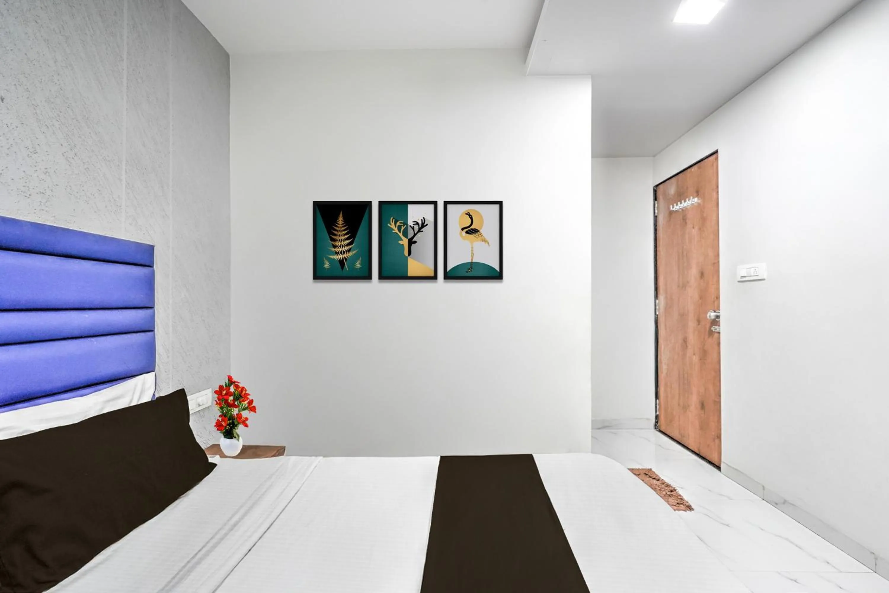 Bedroom in Hotel O Sneh Rashmi Botanical Garden Surat Formerly Stadium Plaza