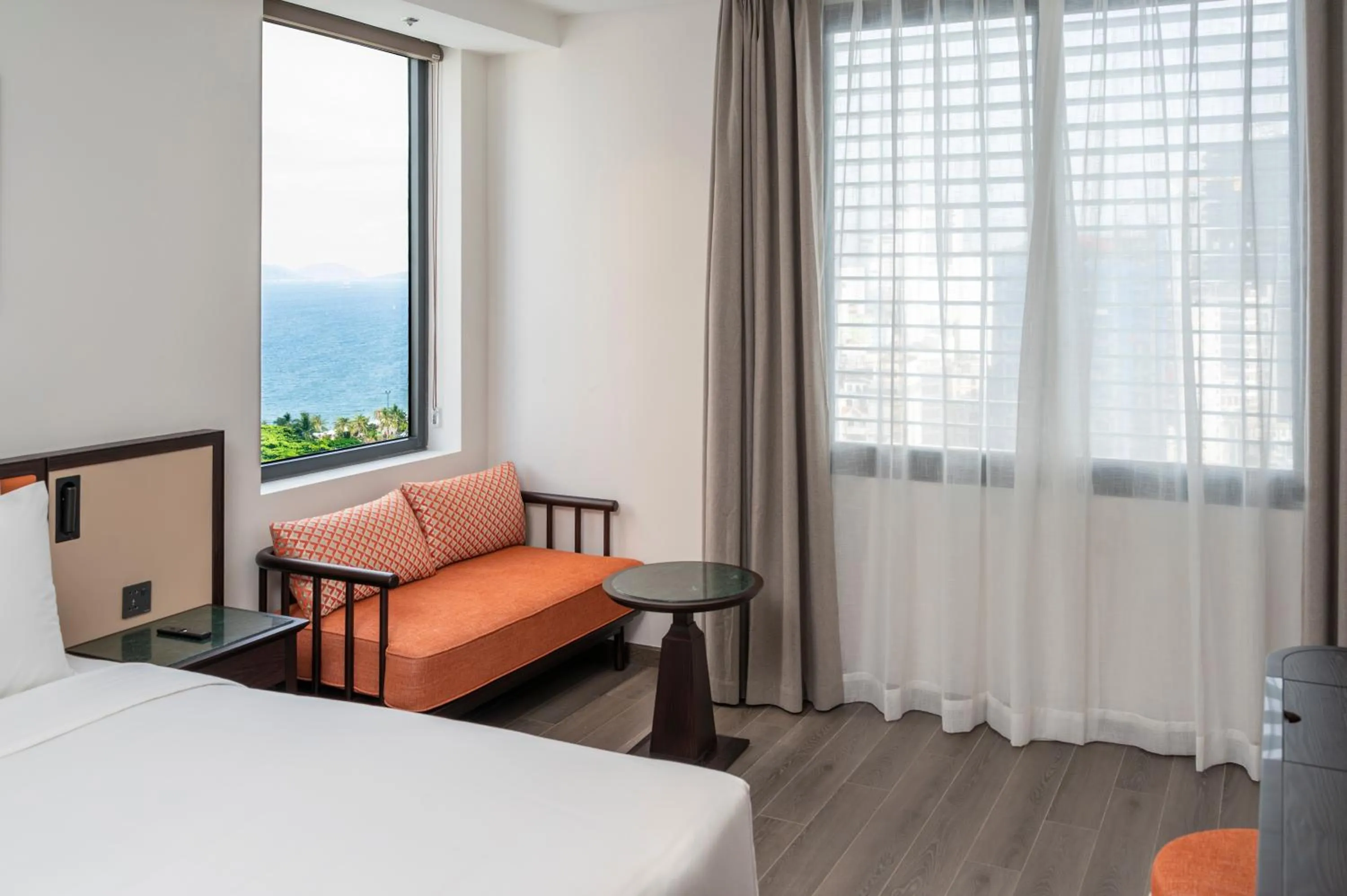 Seating area, Bed in Iconique Hotel Nha Trang