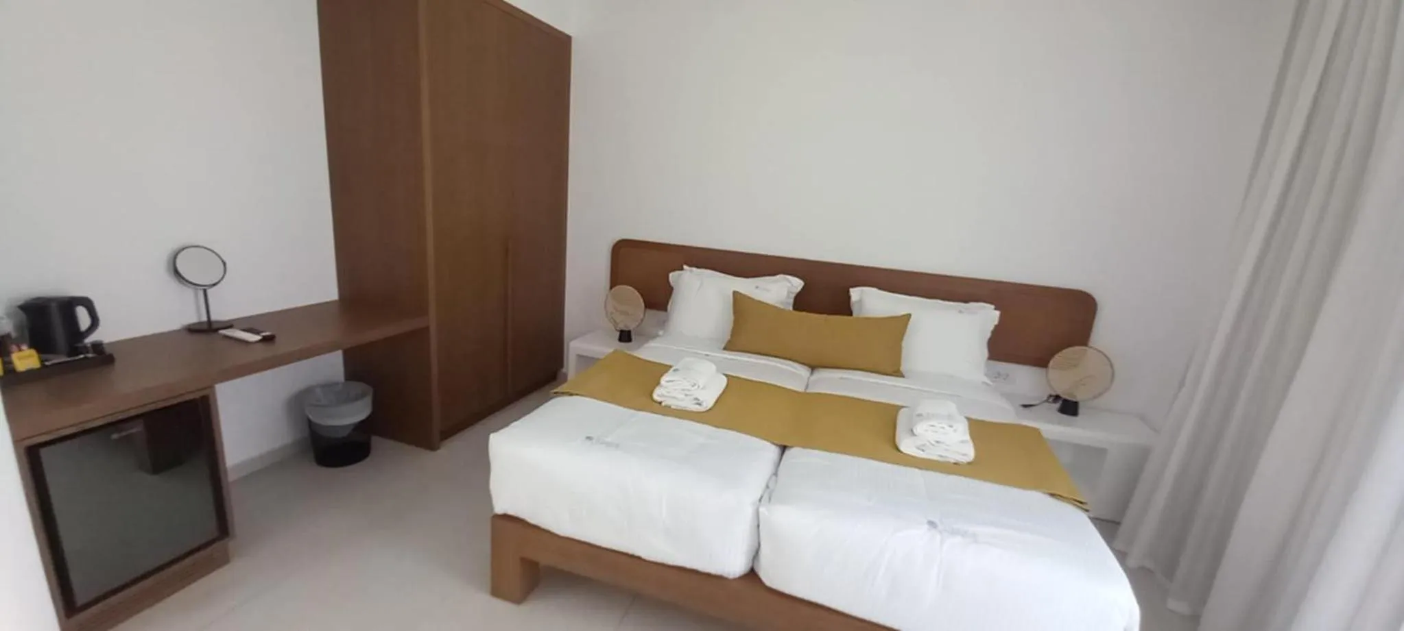 Bed in Tarra Seaside Hotel