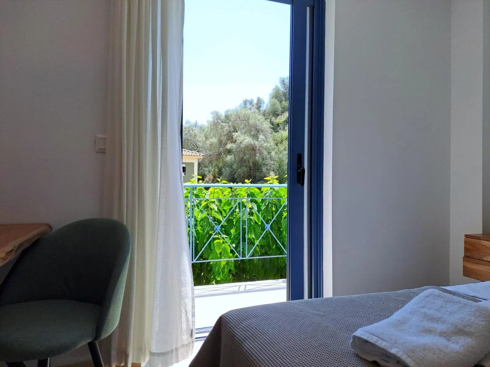 Bed in Ilianthos Apartments & Rooms