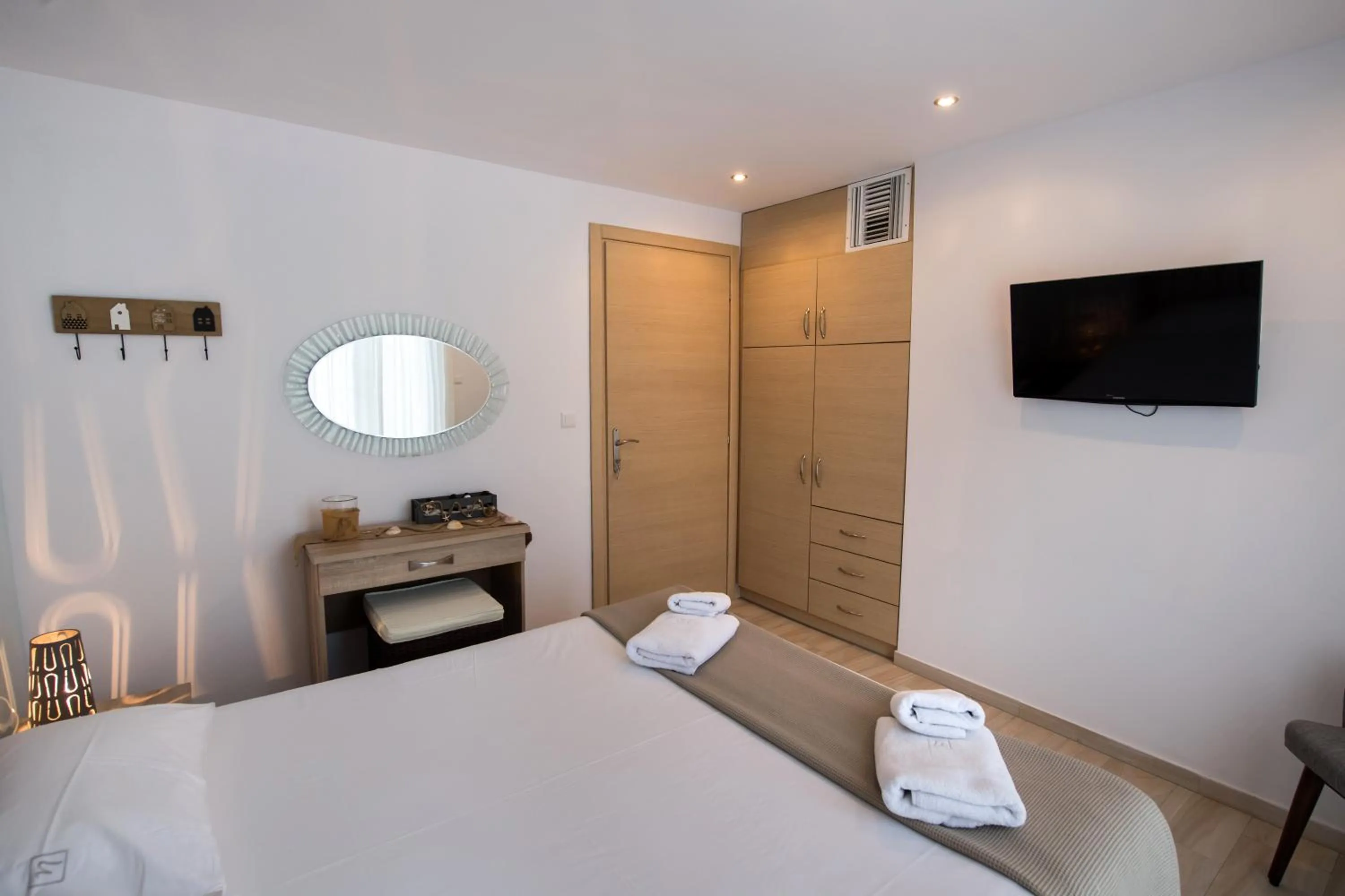 Bed in Ilianthos Apartments & Rooms