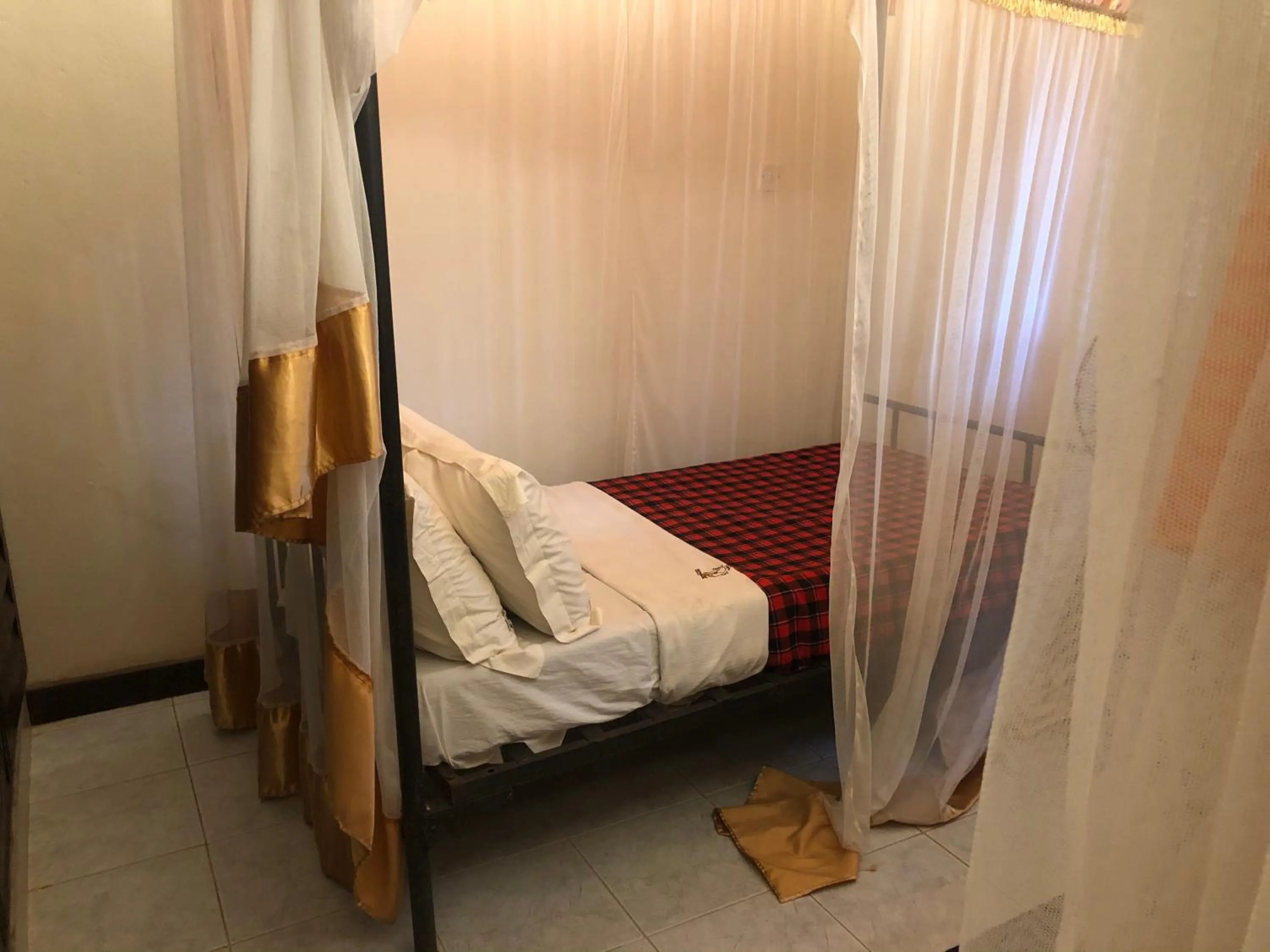 Bed in Impala Safari Lodge