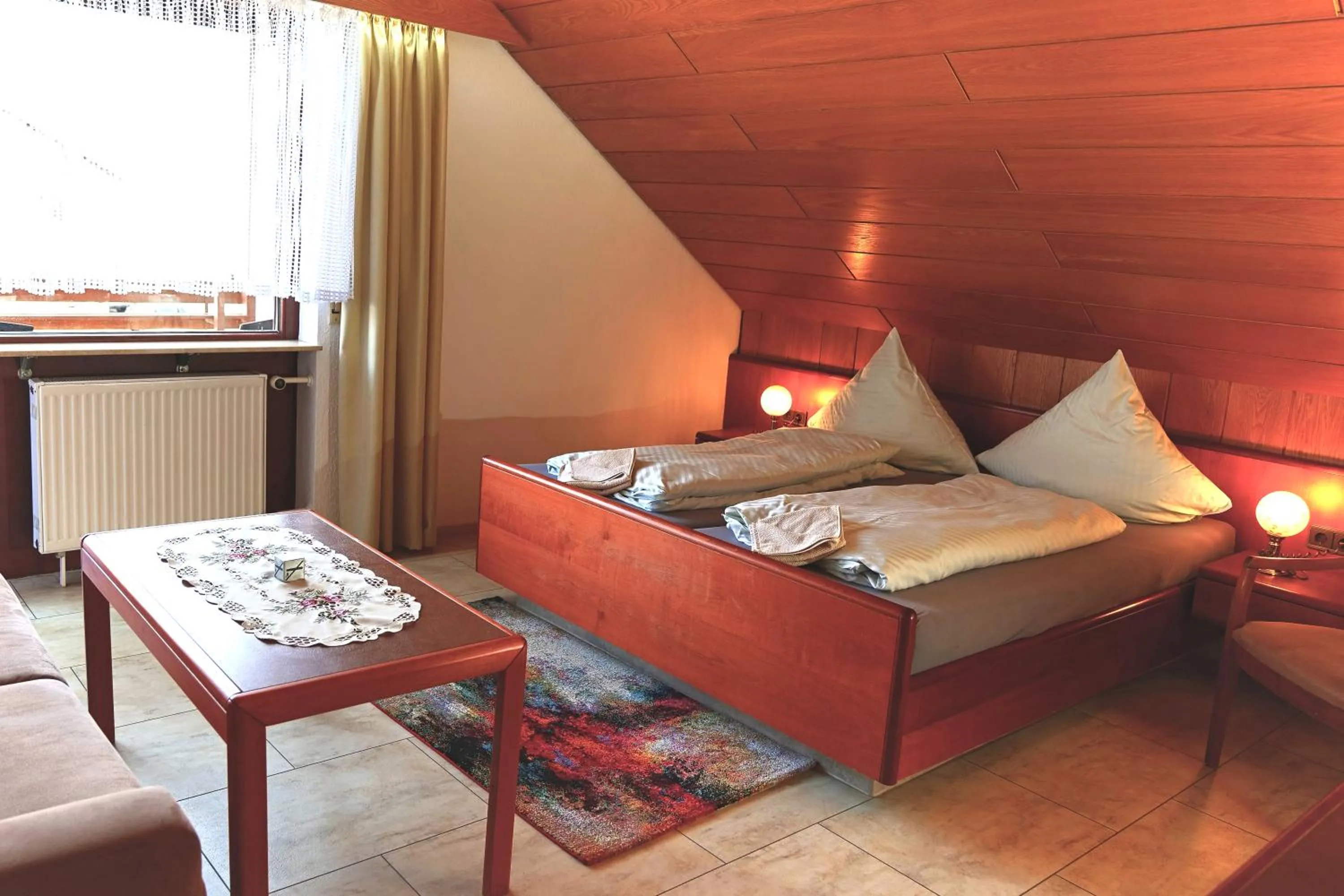 Seating area, Bed in Hotel Garni Sebastian