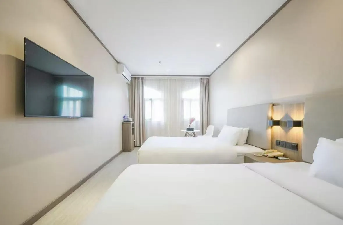 Bed in Hanting Hotel Shanghai Songjiang Sijing