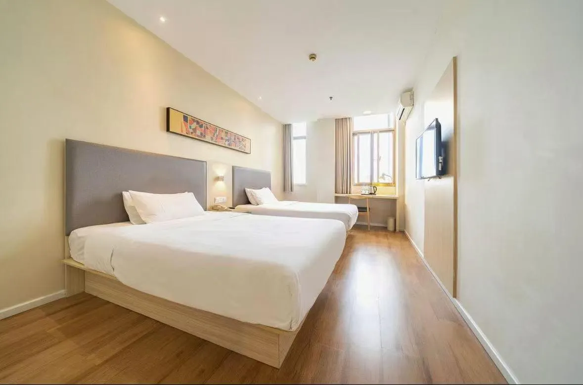 Bed in Hanting Hotel Shanghai Songjiang Sijing