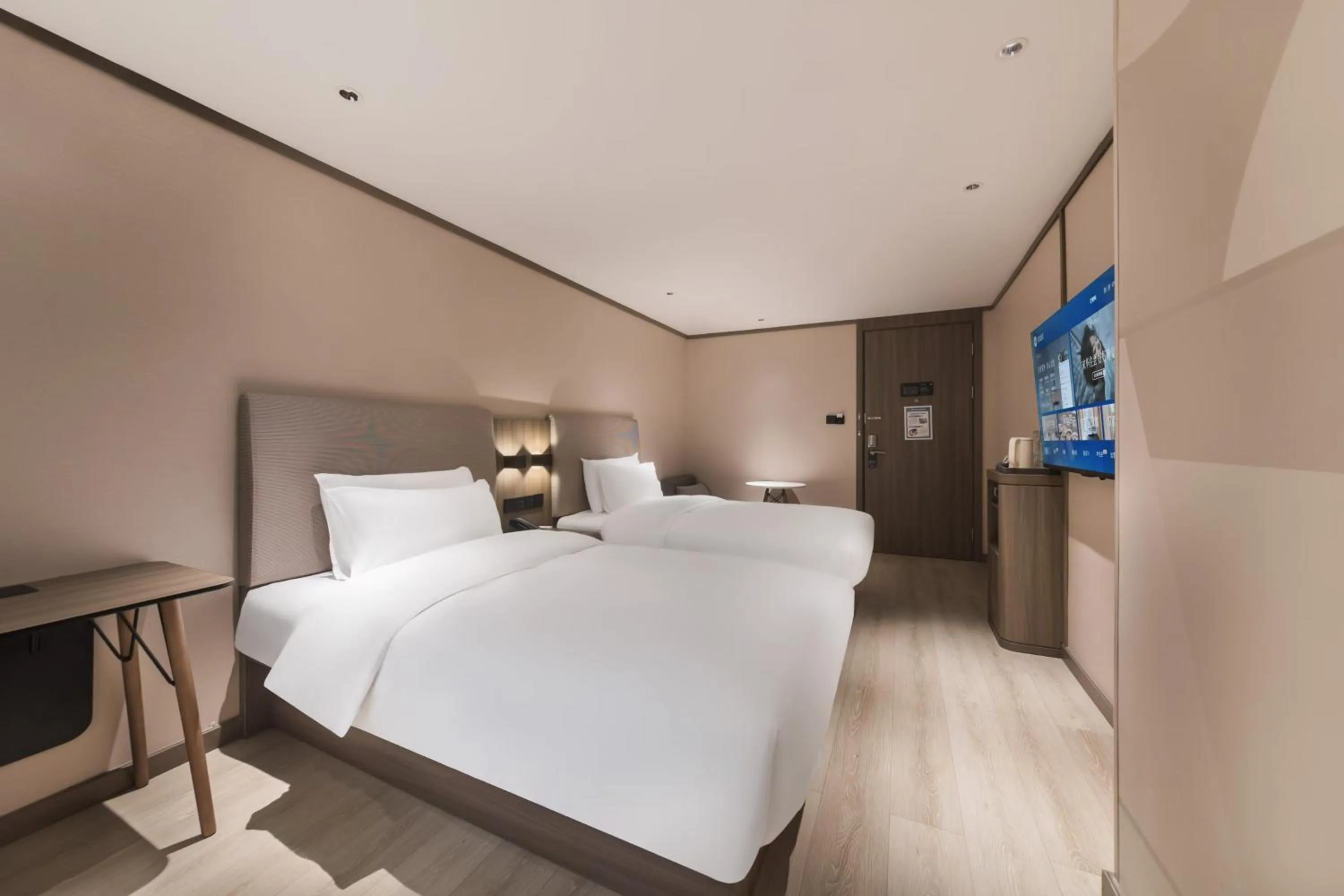 Bed in Hanting Hotel Nanjing Jiangpu Longhua Road Subway Station