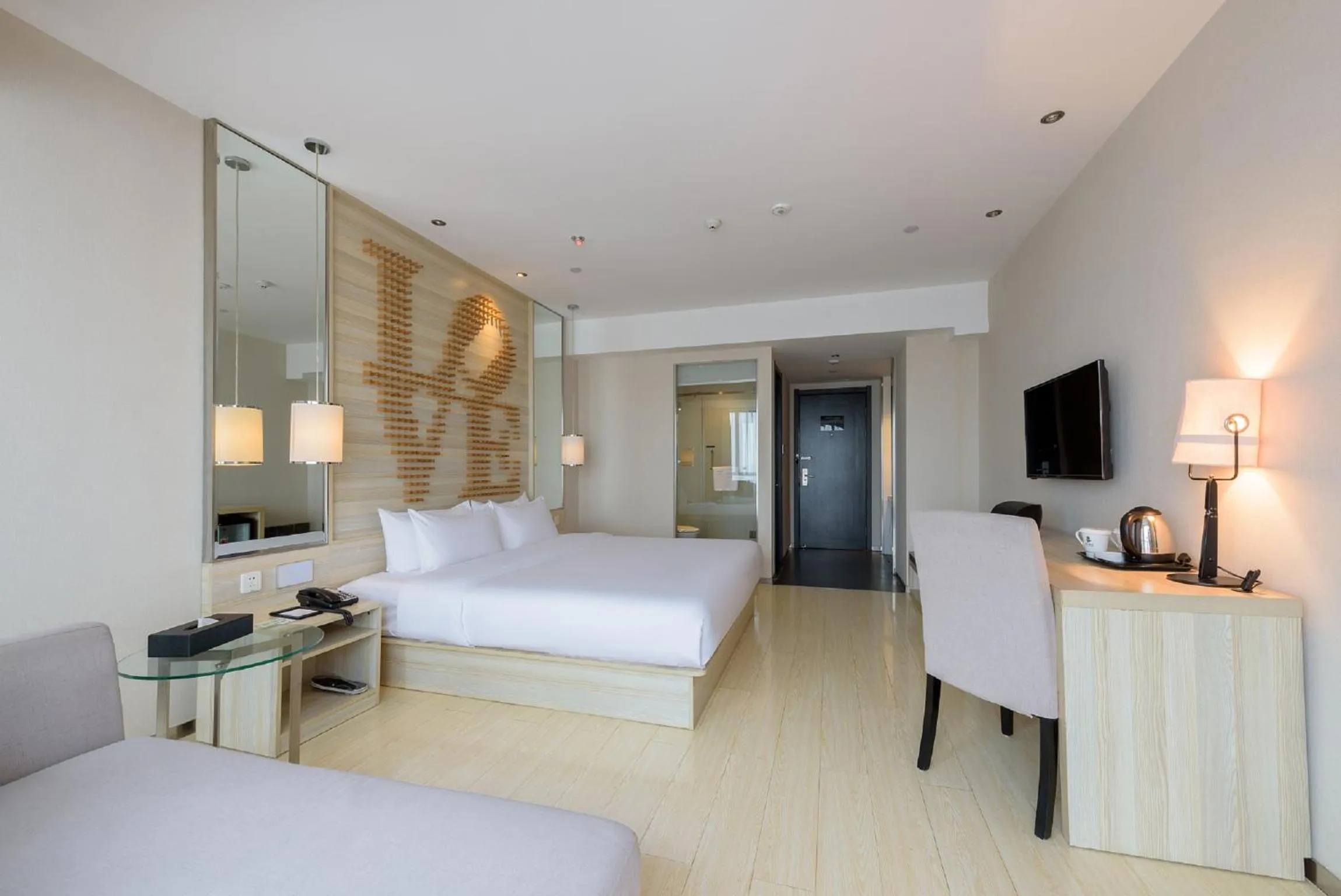 Bed in Orange Hotel Hangzhou Jiubao Passenger Transport Center