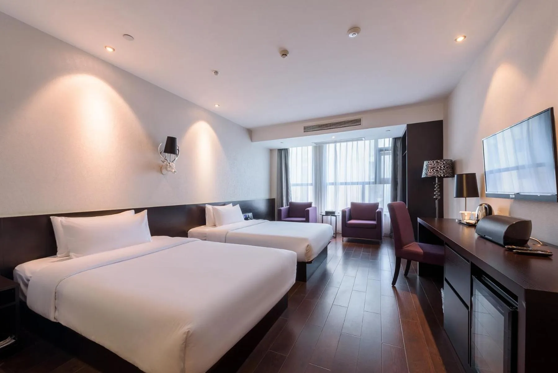 Bed in Orange Hotel Hangzhou Jiubao Passenger Transport Center