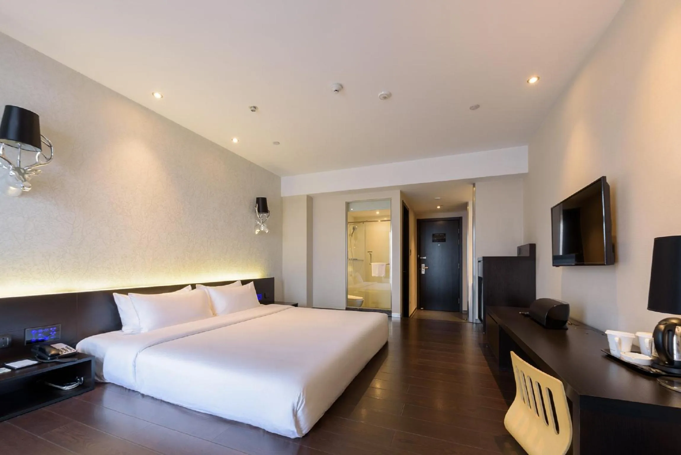 Bed in Orange Hotel Hangzhou Jiubao Passenger Transport Center