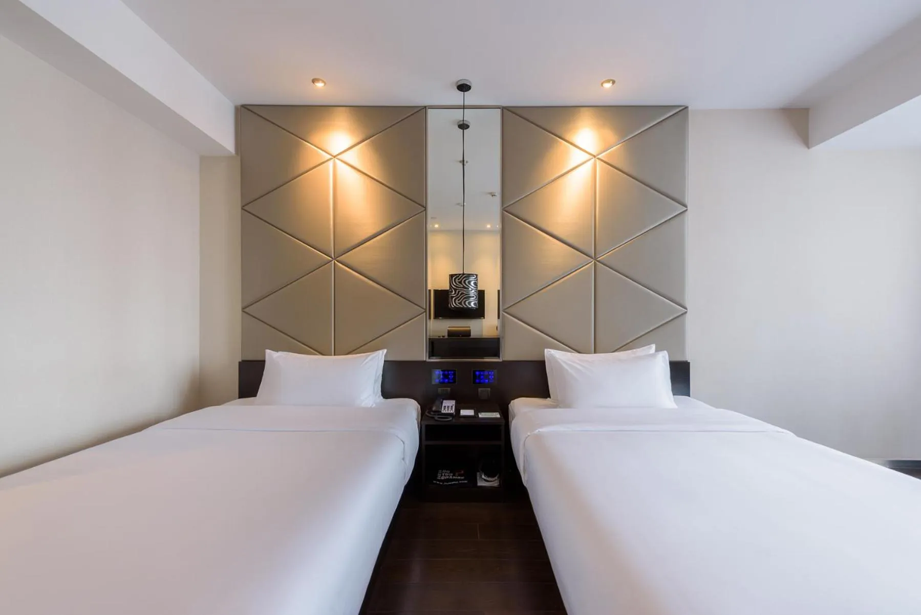 Bed in Orange Hotel Hangzhou Jiubao Passenger Transport Center