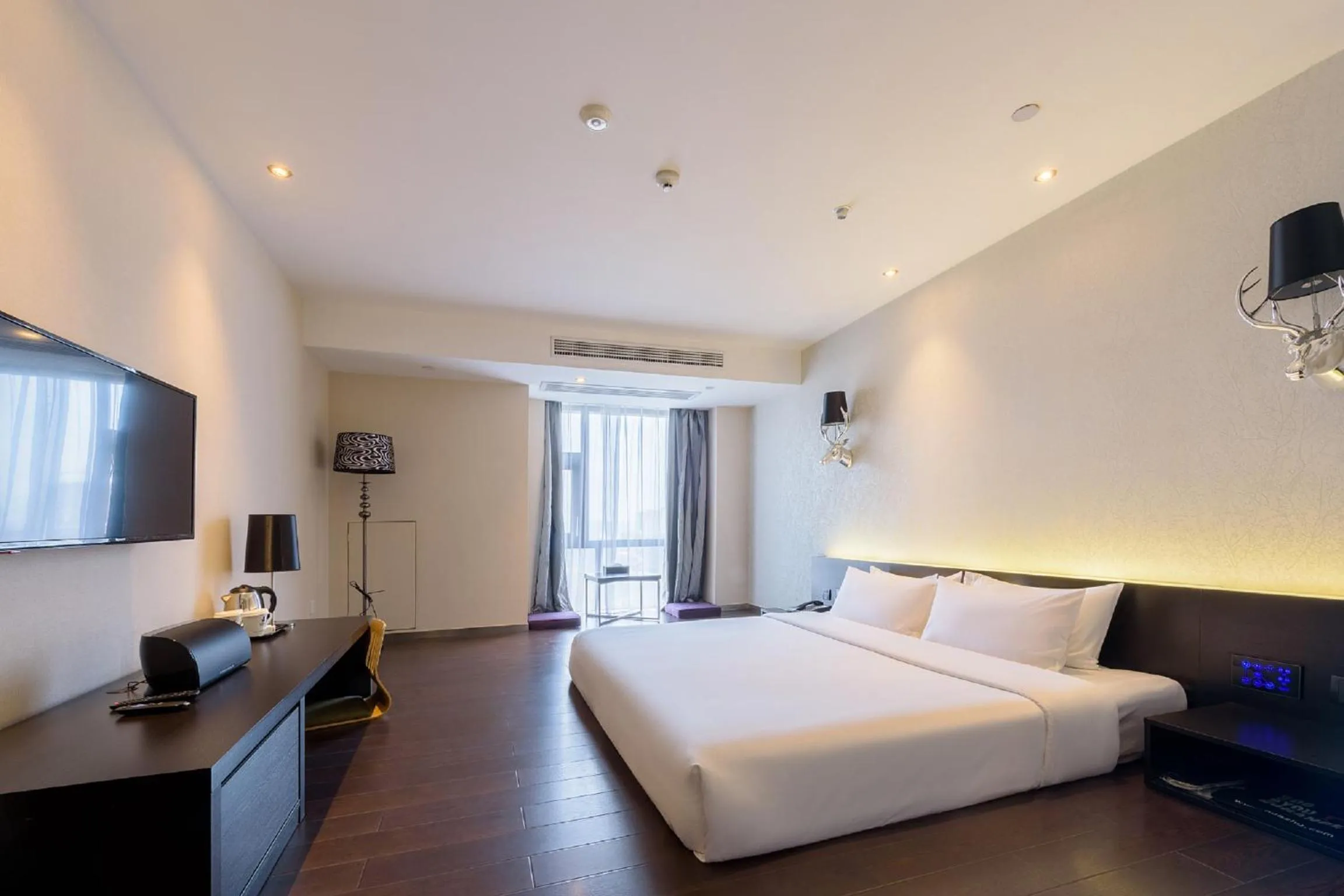 Bed in Orange Hotel Hangzhou Jiubao Passenger Transport Center