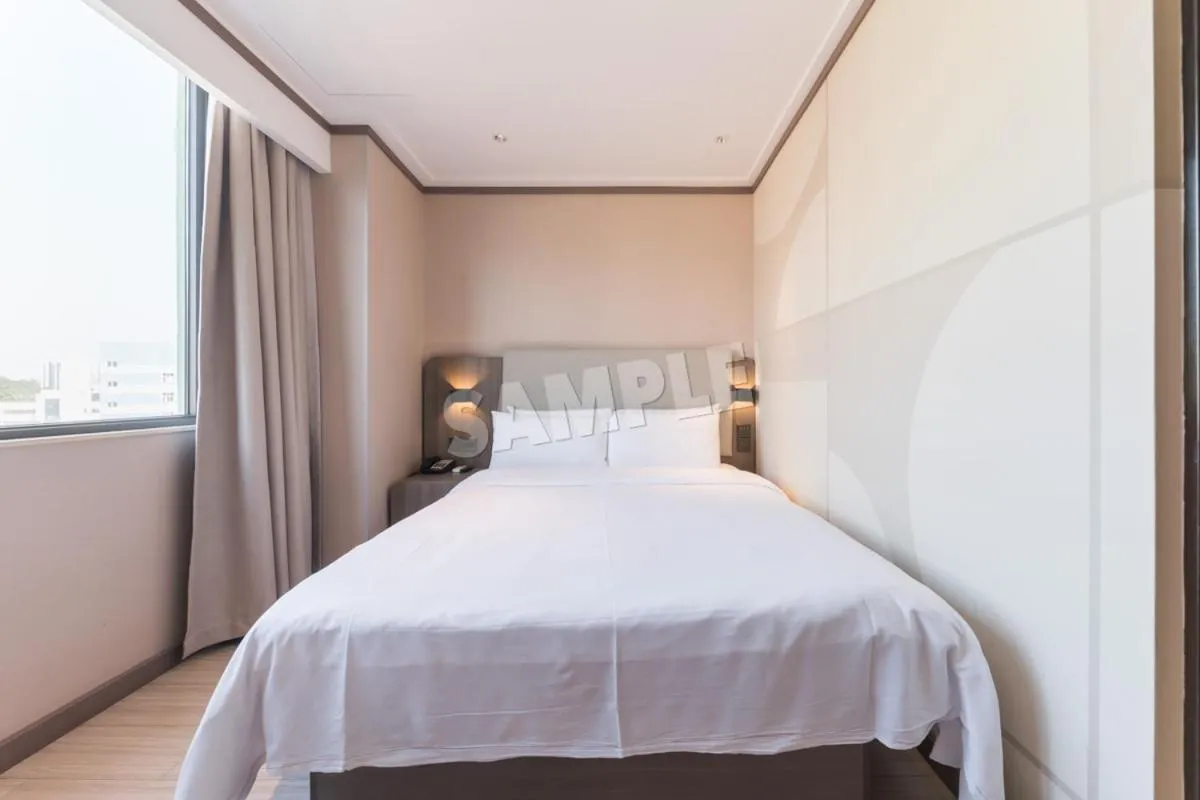 Bed in Hanting Hotel Shenzhen Vanke Yuncheng Xili Subway Station