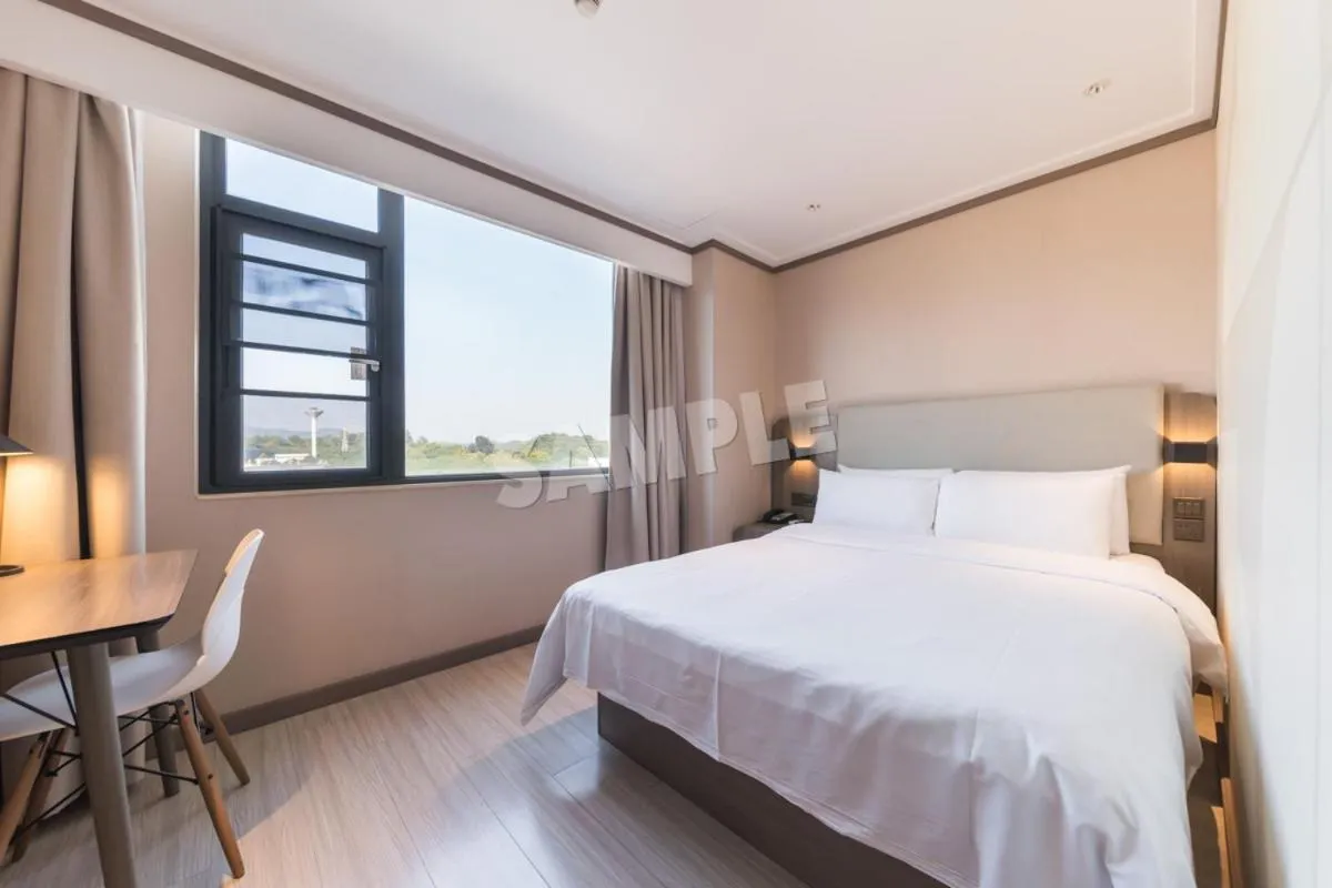 Bed in Hanting Hotel Shenzhen Vanke Yuncheng Xili Subway Station
