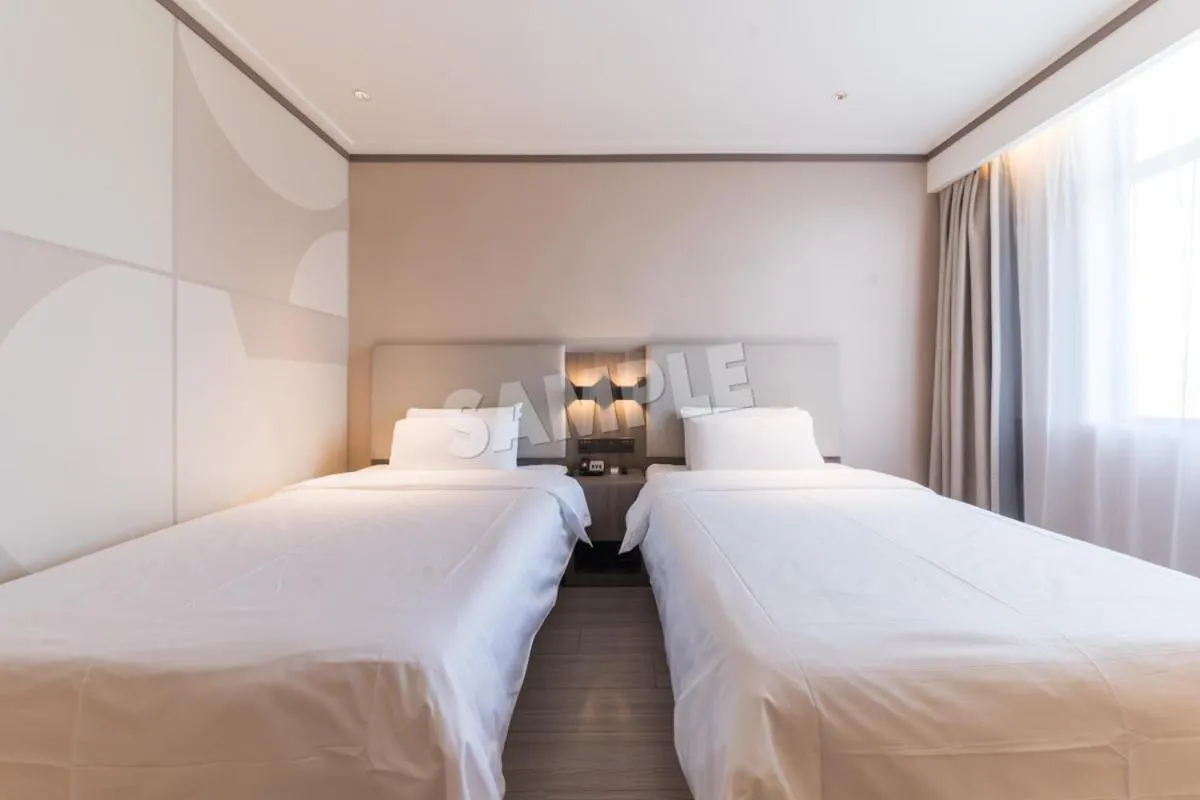 Bed in Hanting Hotel Shenzhen Vanke Yuncheng Xili Subway Station