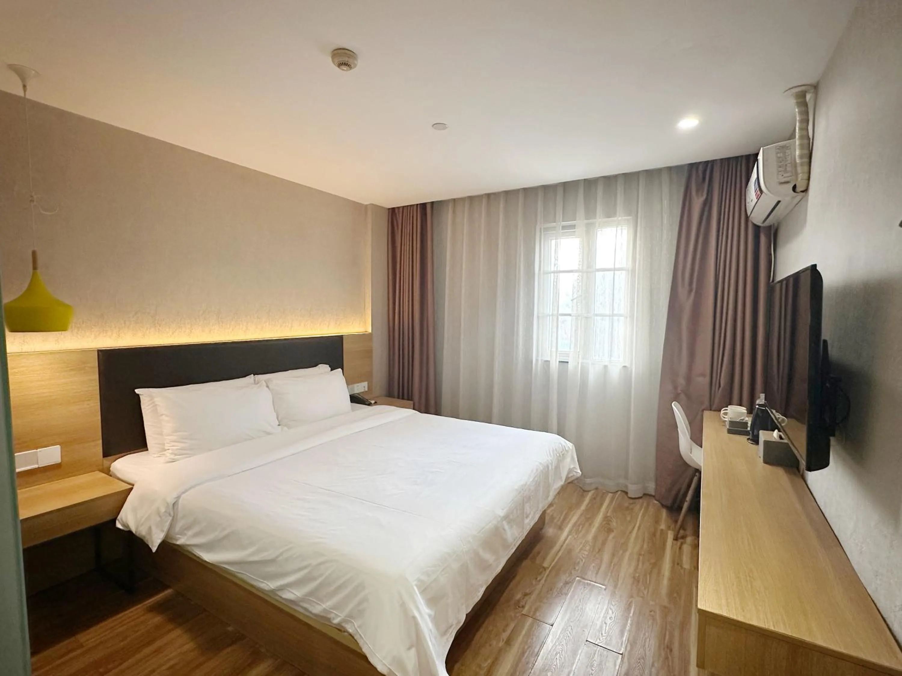 Bed in Hanting Hotel Guangzhou Feixiang Park Subway Station