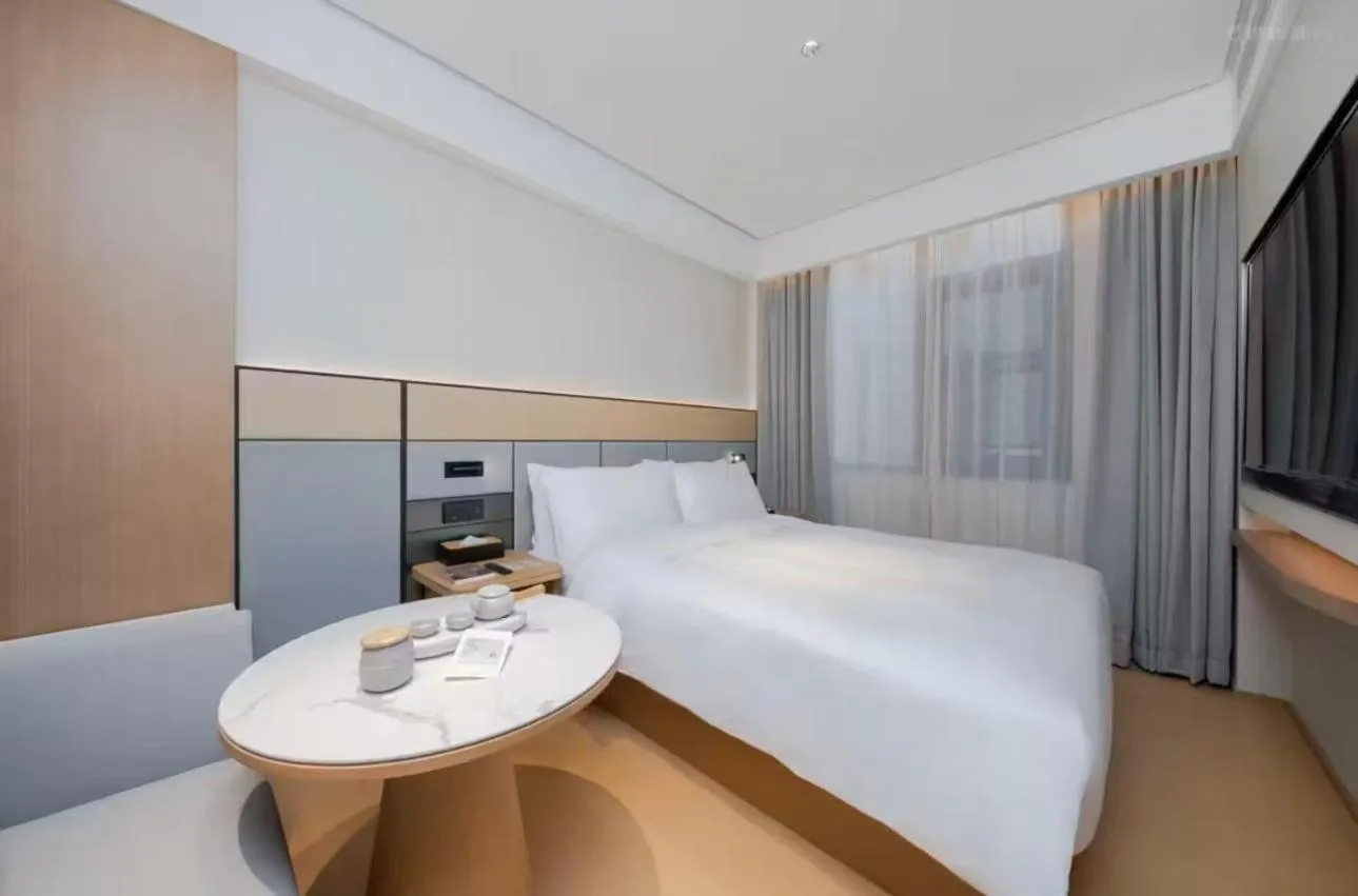 Bed in JI Hotel Beijing Yansha Sanyuan Bridge