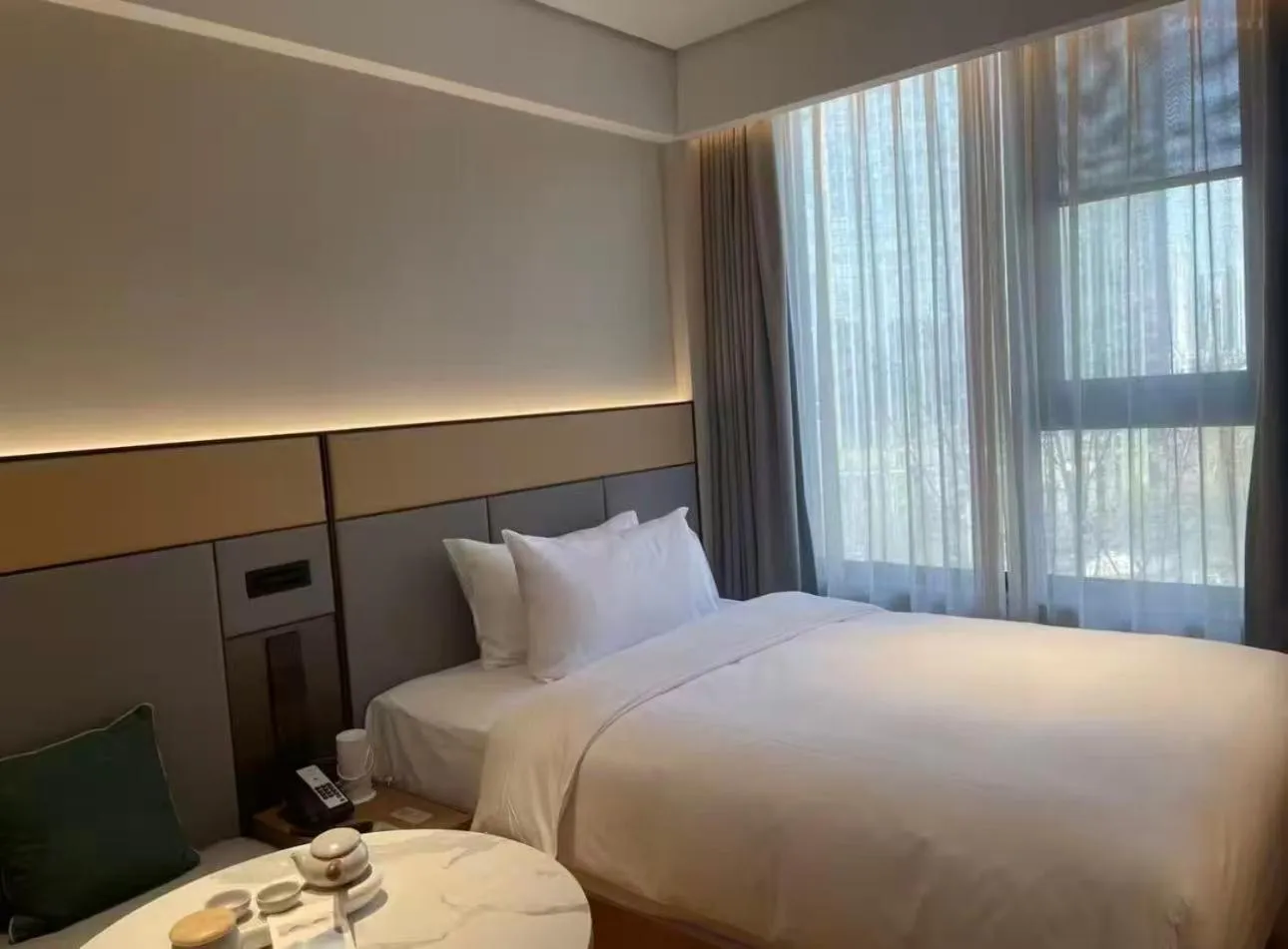 Bed in JI Hotel Beijing Yansha Sanyuan Bridge