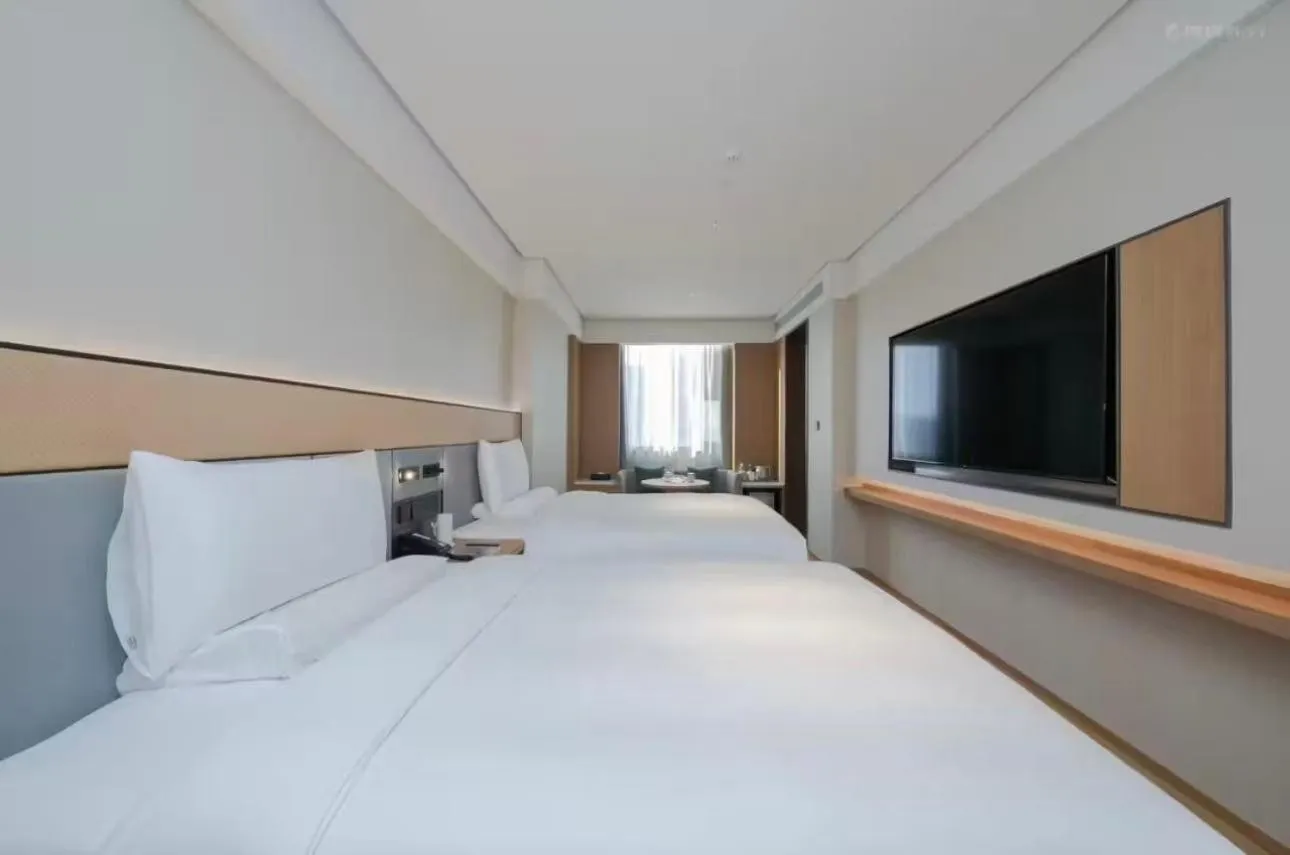 Bed in JI Hotel Beijing Yansha Sanyuan Bridge