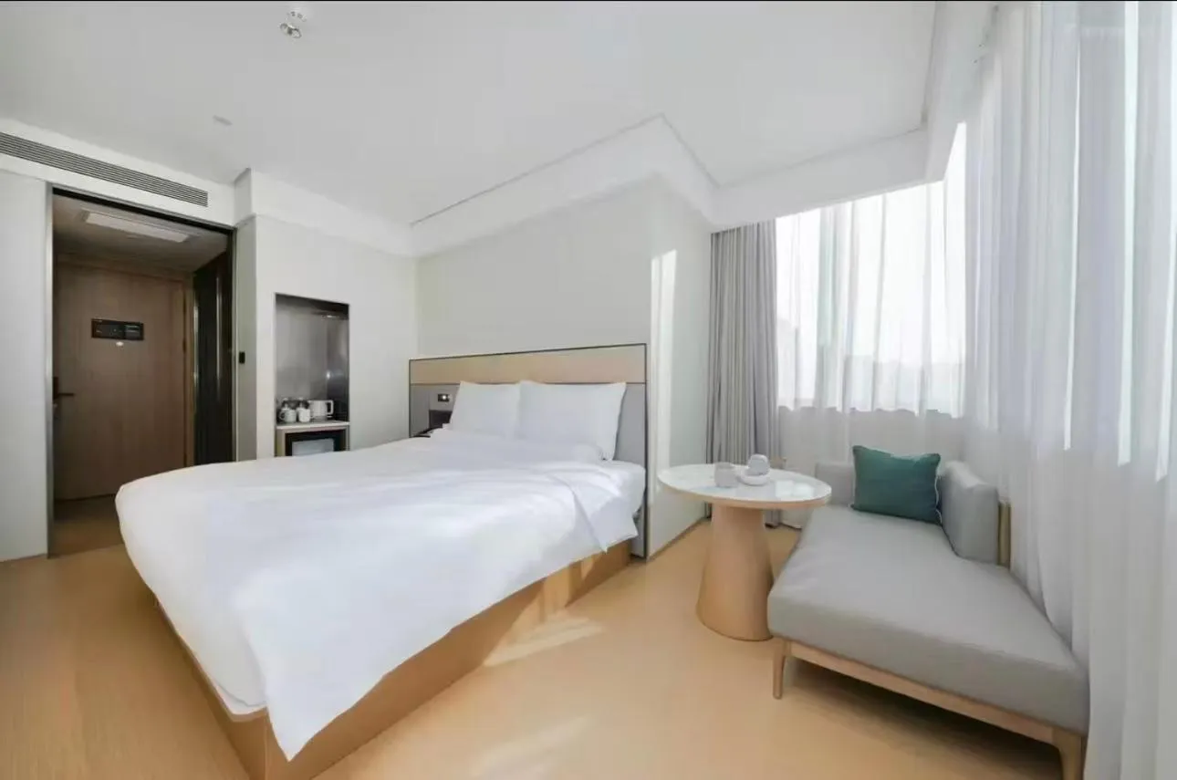 Bed in JI Hotel Beijing Yansha Sanyuan Bridge