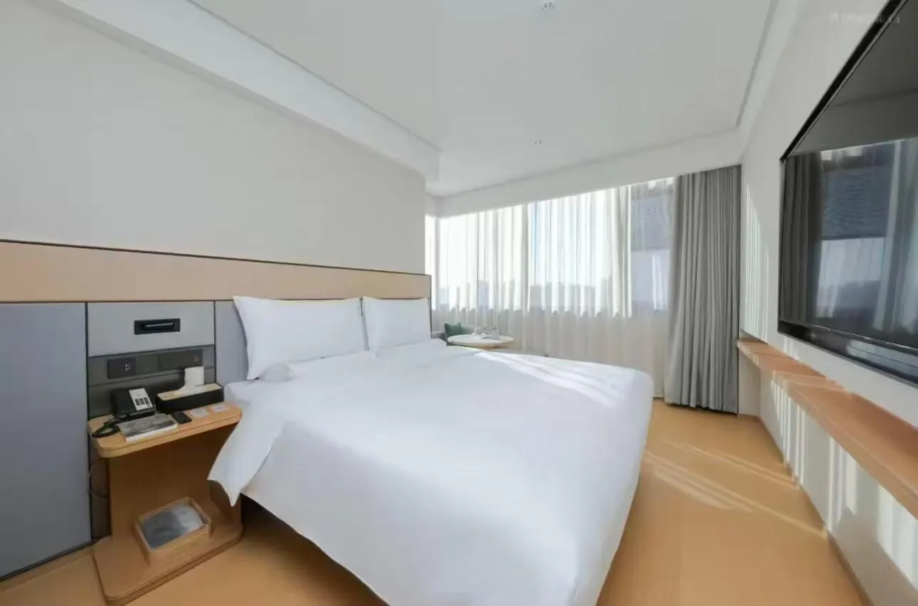 Bed in JI Hotel Beijing Yansha Sanyuan Bridge