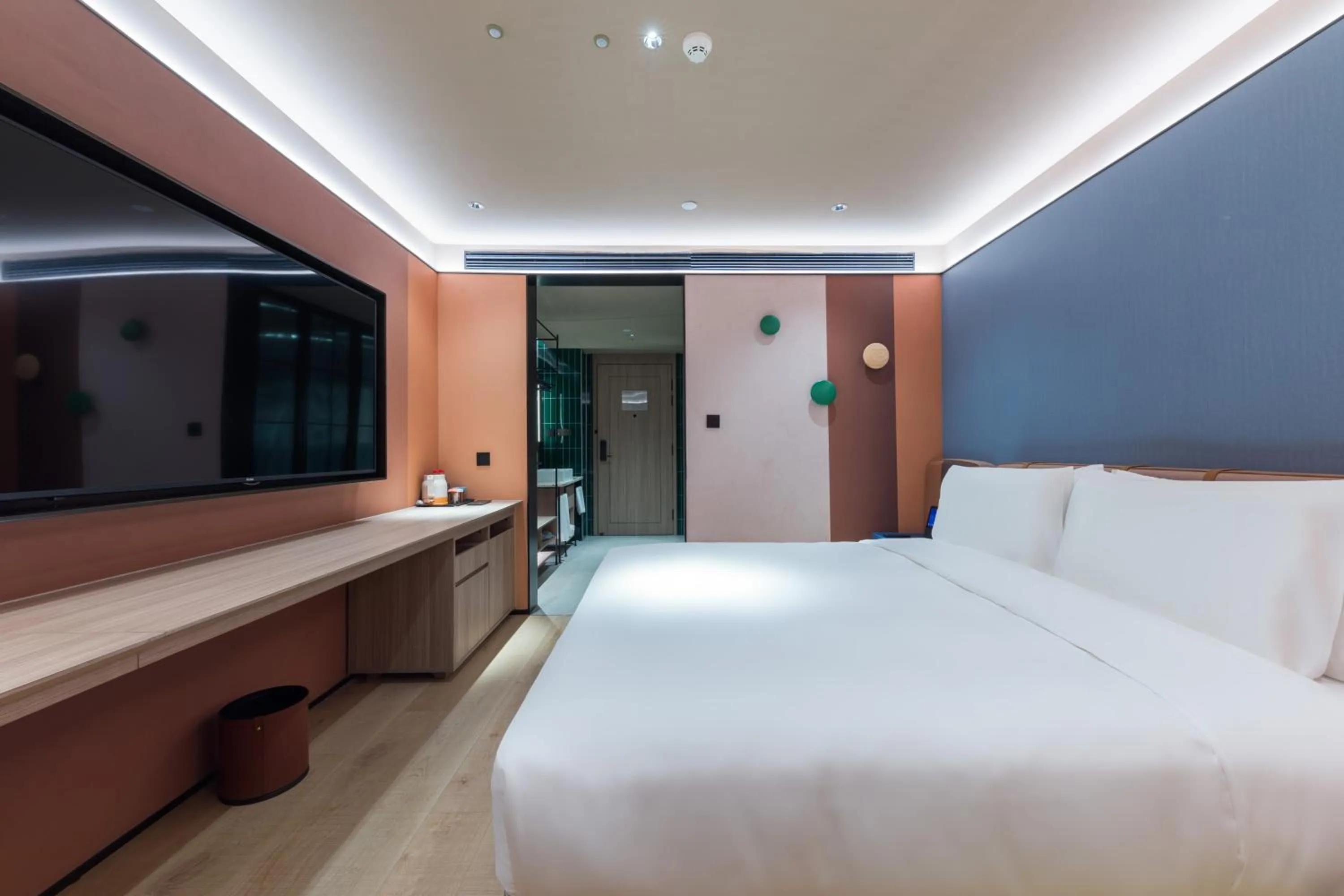 Bed in Orange Hotel Shanghai World Expo Center