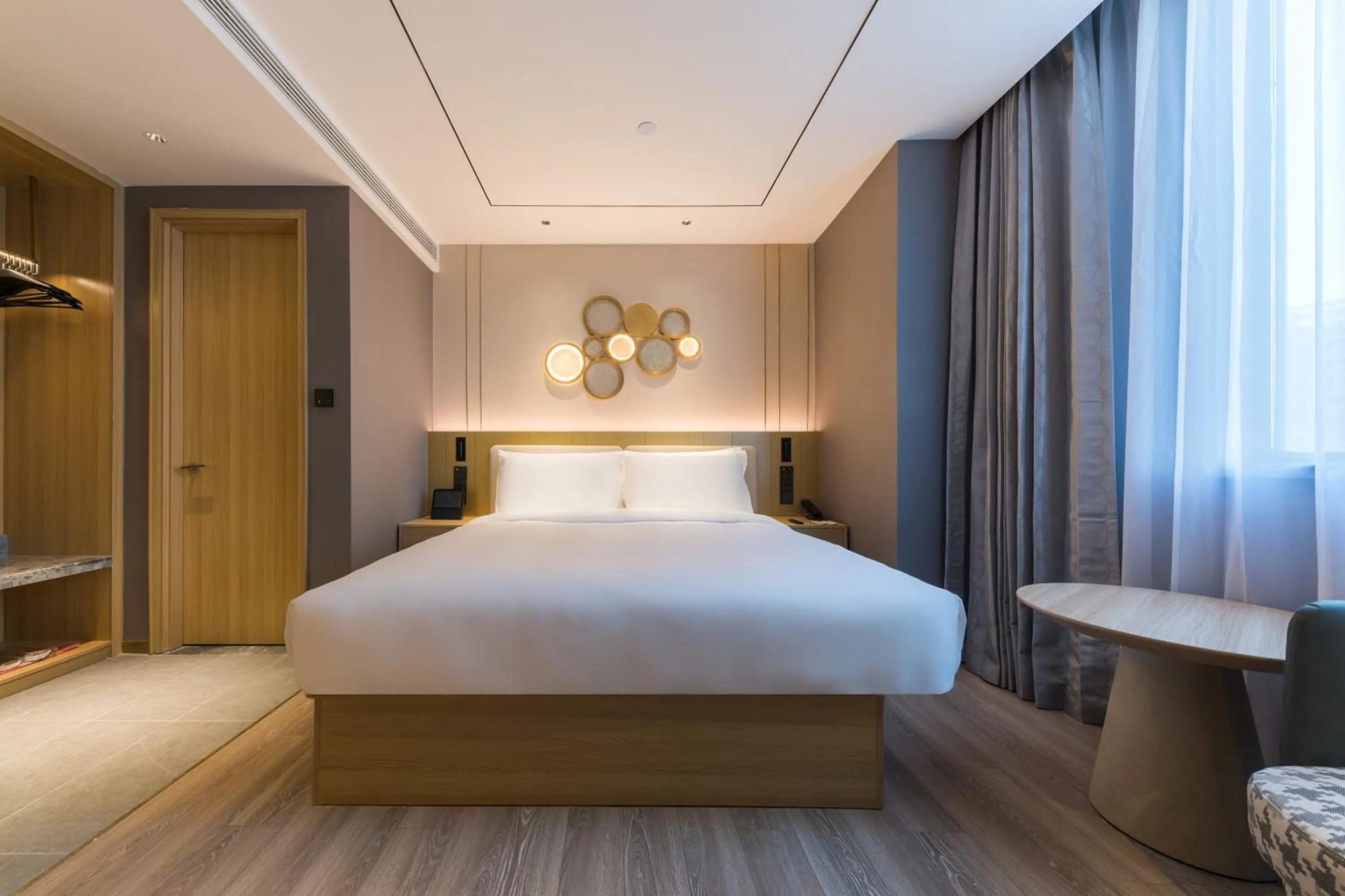 Bed in Orange Hotel Shanghai World Expo Center