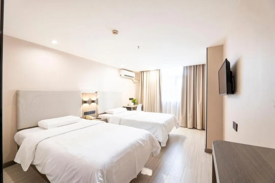 Bed in Hanting Hotel Shenzhen Taian Subway Station