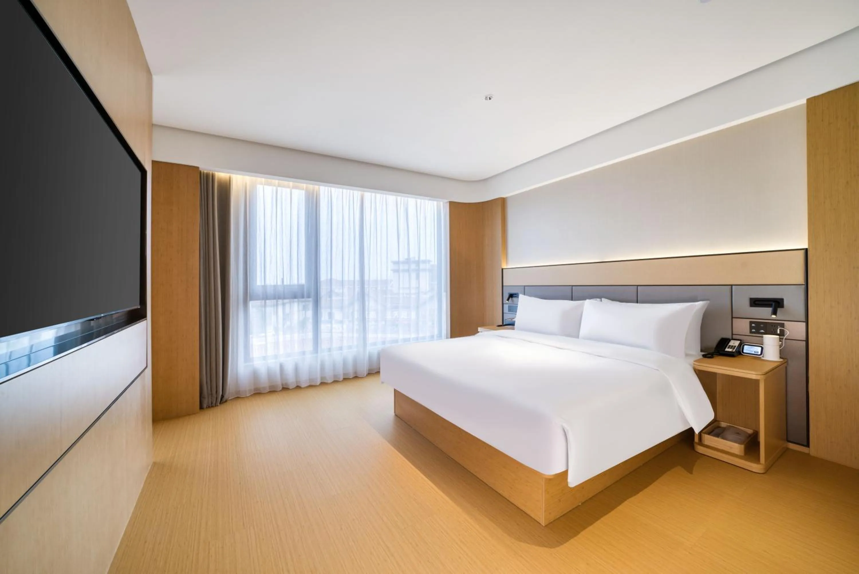 Bed in JI Hotel Shanghai Chongming Changxing Island