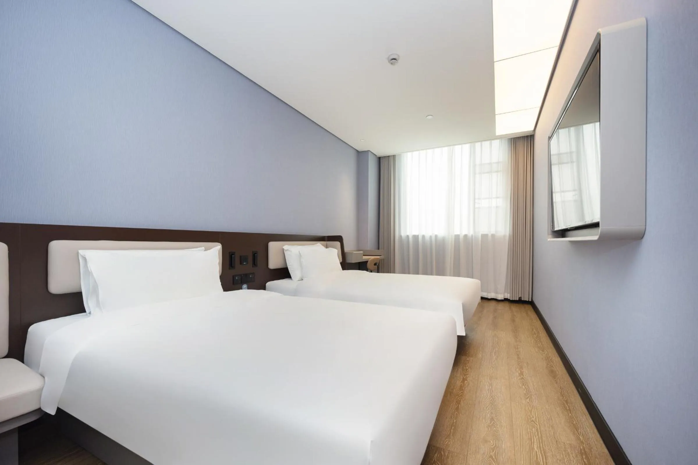 Bed in Hanting Hotel Shanghai Yishan Road Center