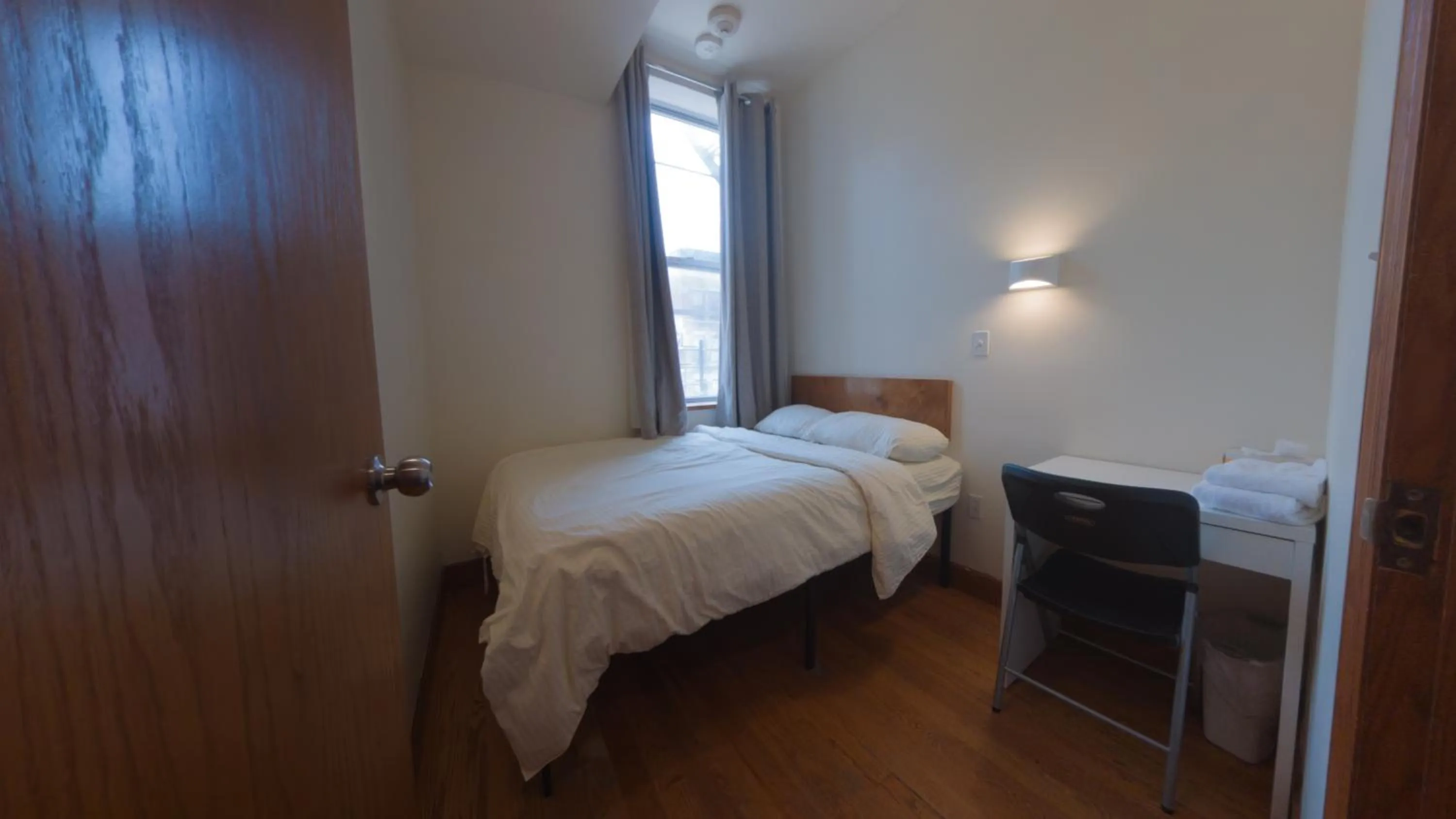 Bed in U.S. Pacific Hotel