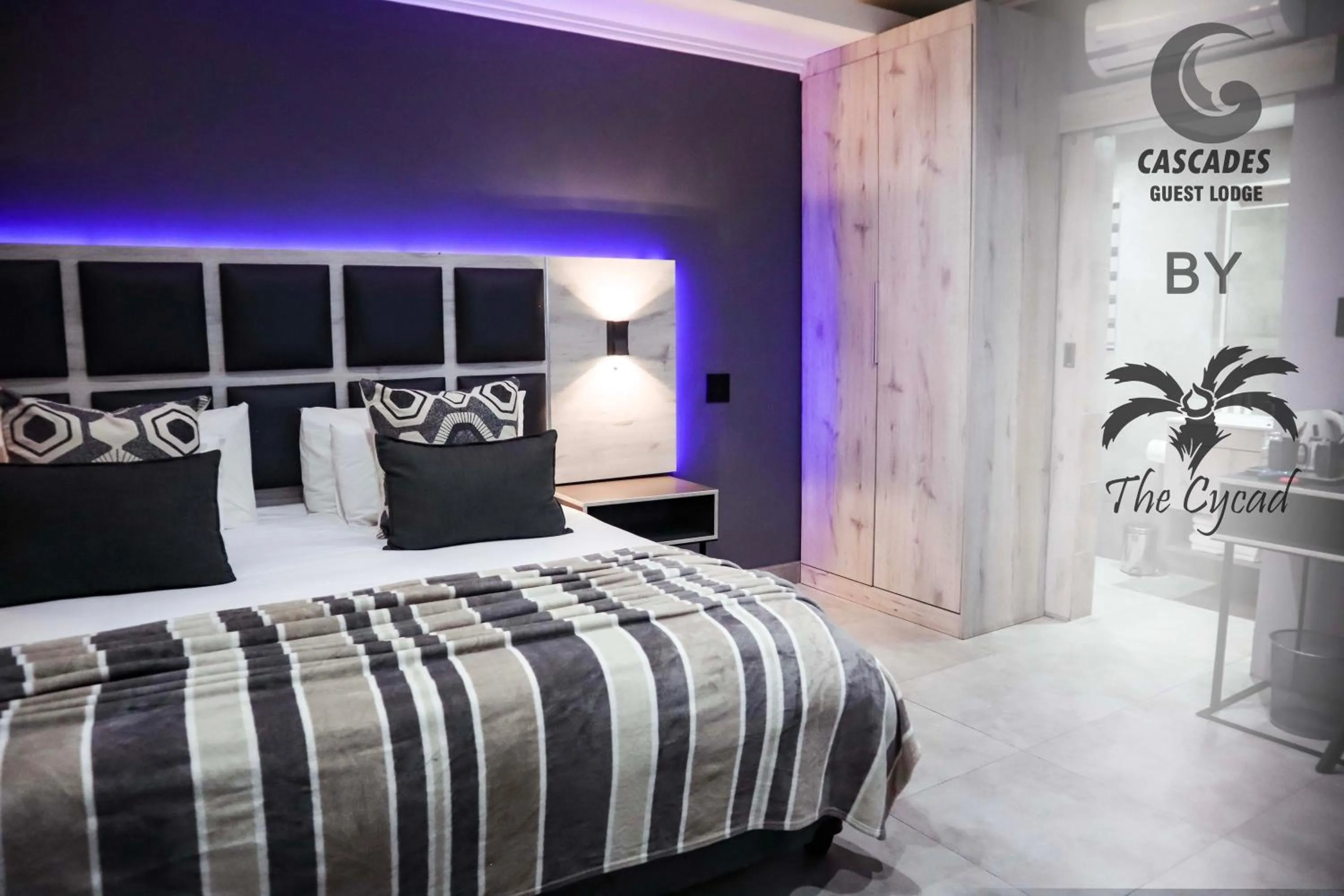 Bed in The Cycad Lodge & Chalets