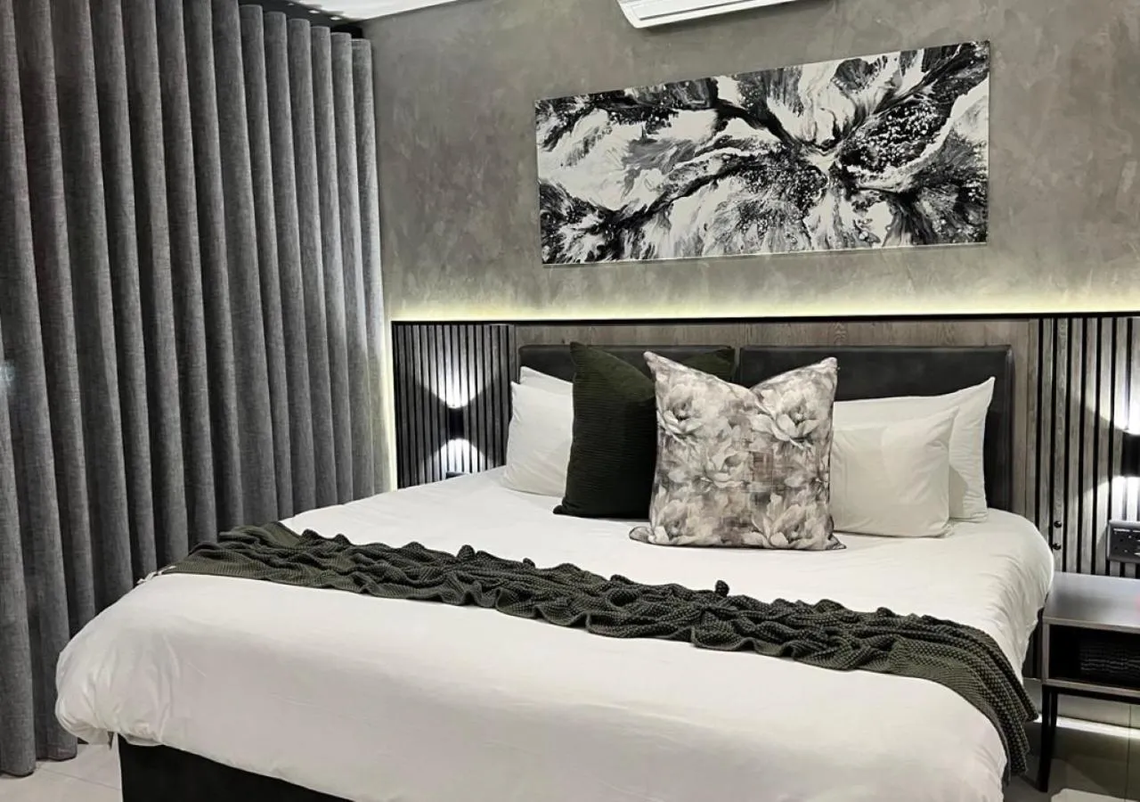 Bed in The Cycad Lodge & Chalets