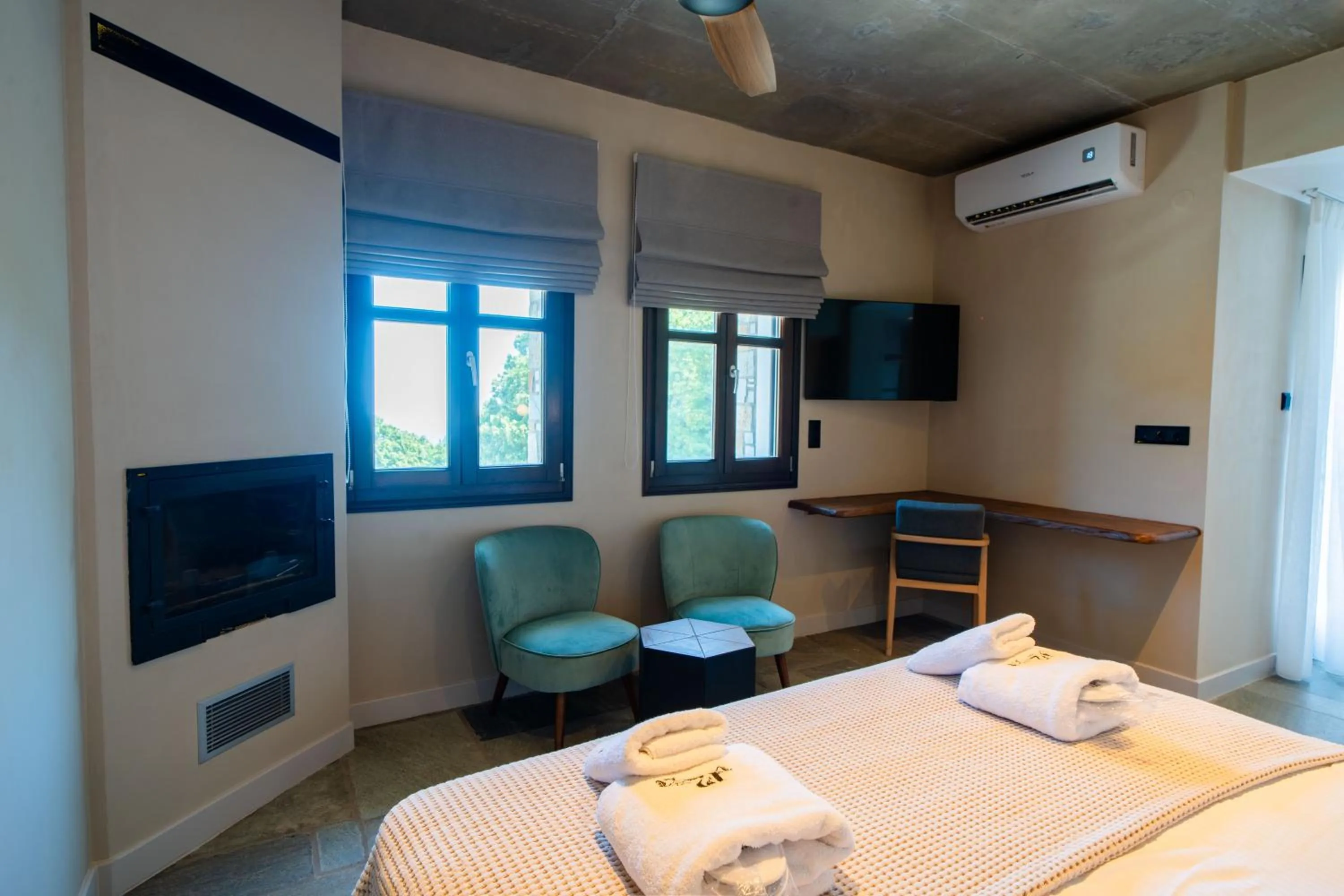 fireplace, Bed in 12 Months Resort & Spa