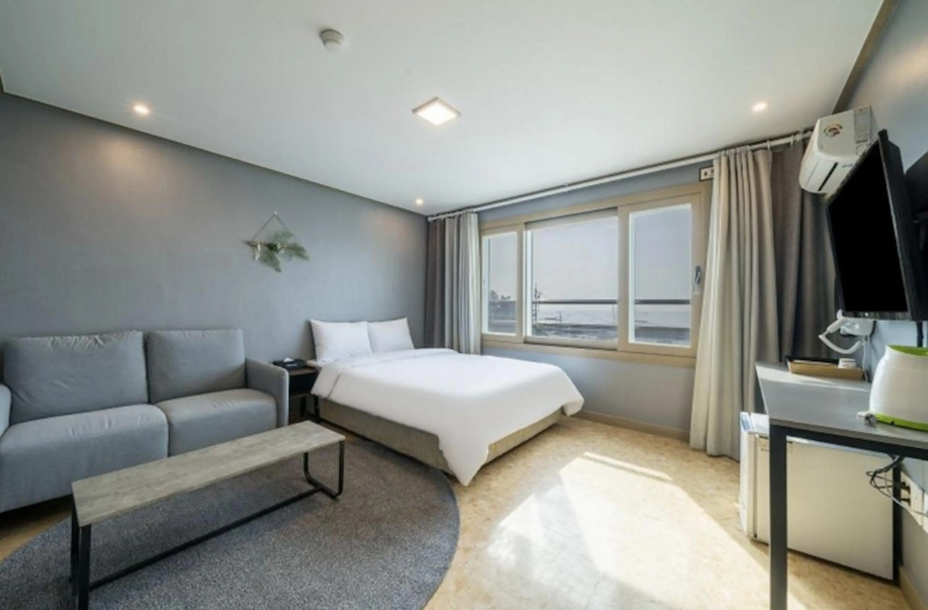 Bed in Jeju Pure Stay Ocean