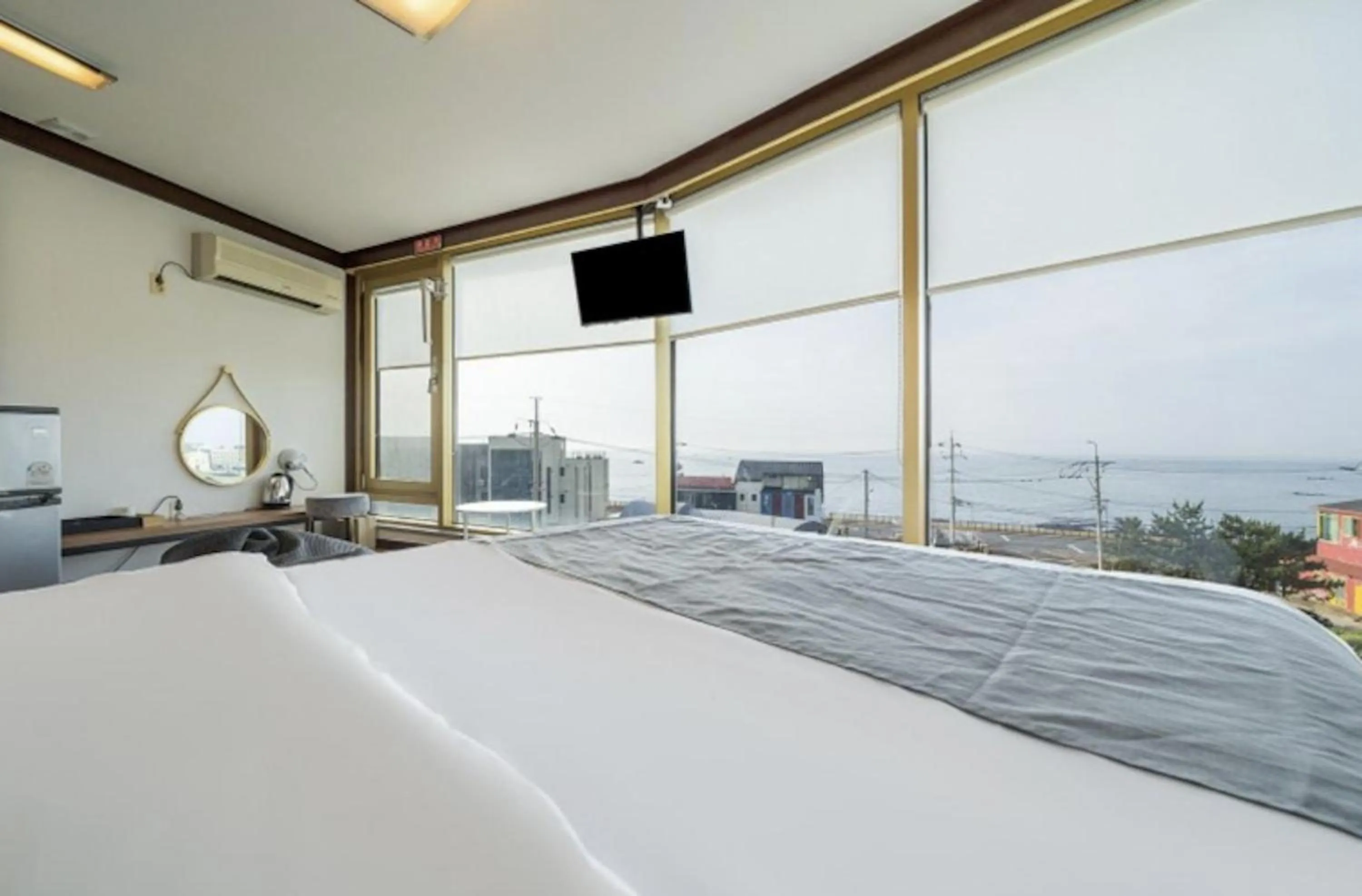 Bed in Jeju Pure Stay Ocean