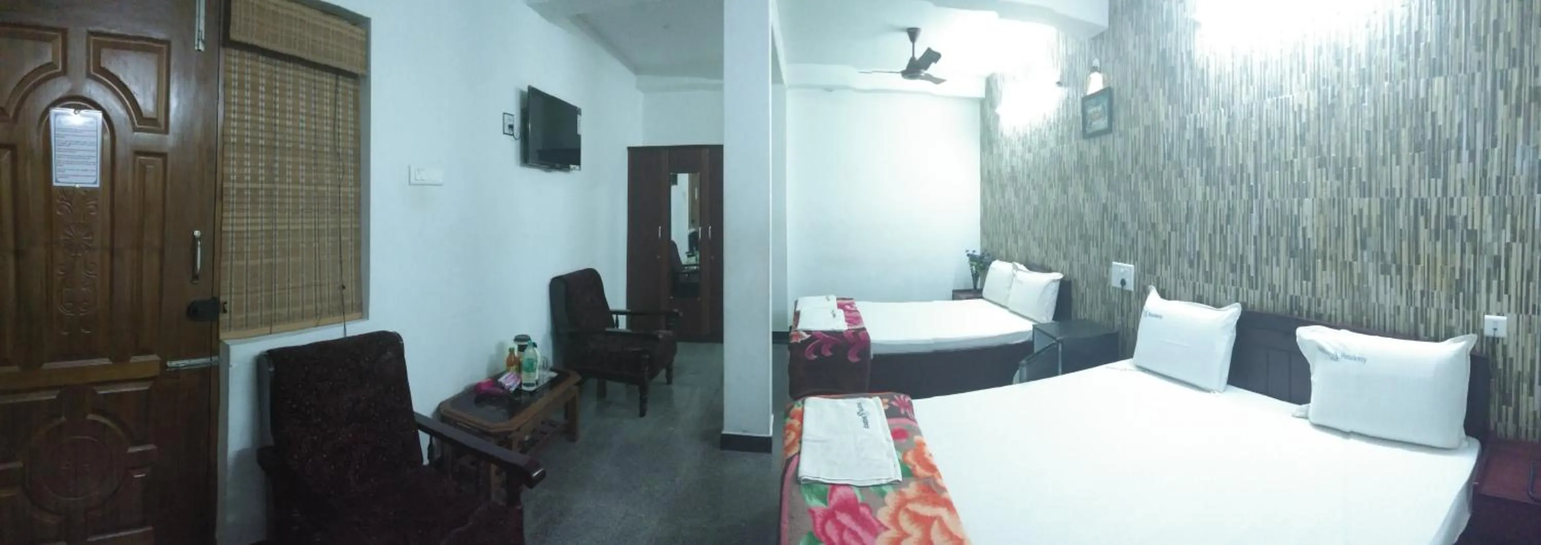 Photo of the whole room, Bed in Arudhra Residency