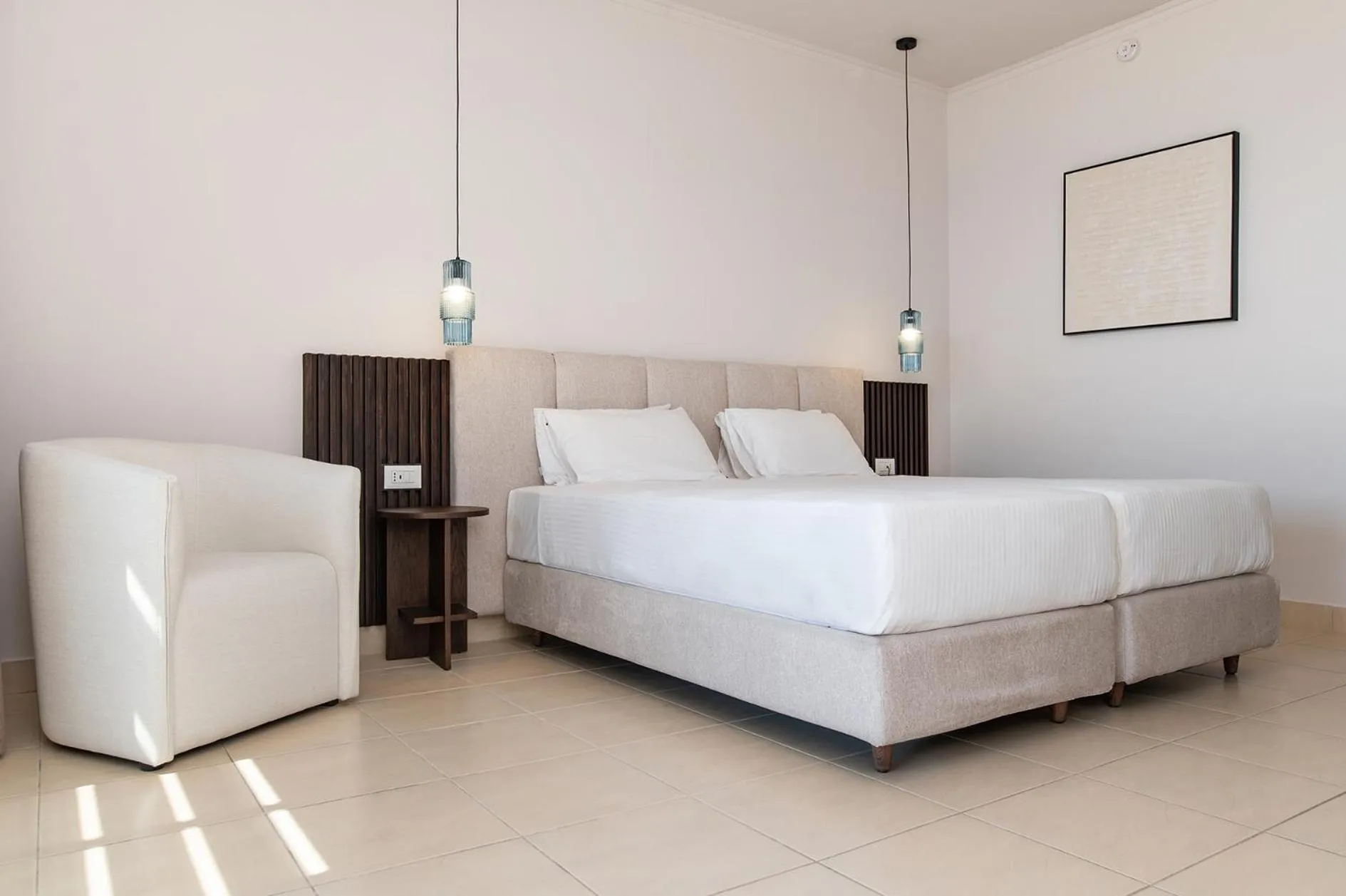 Bed in Grand Blue Beach Hotel