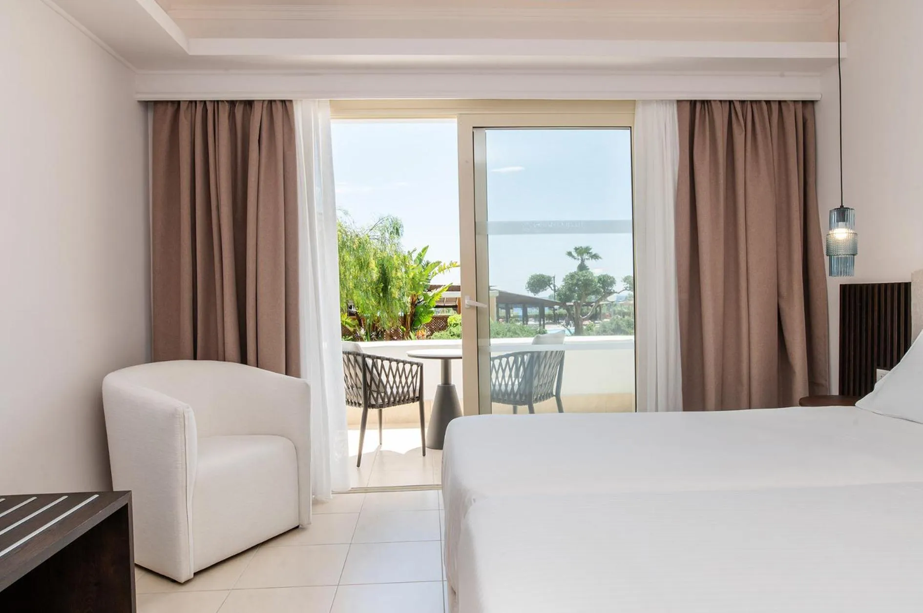 Bed in Grand Blue Beach Hotel