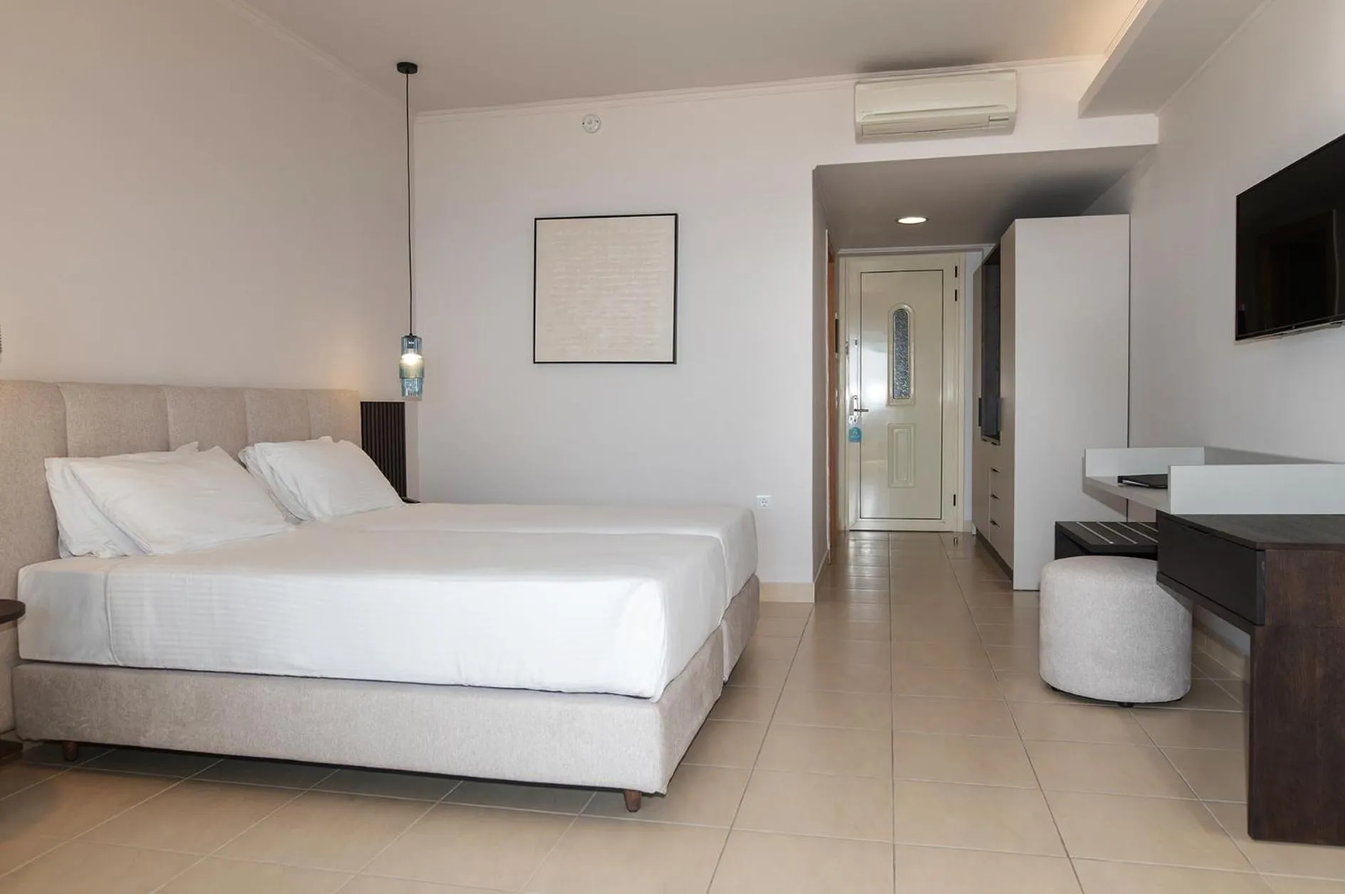 Bed in Grand Blue Beach Hotel